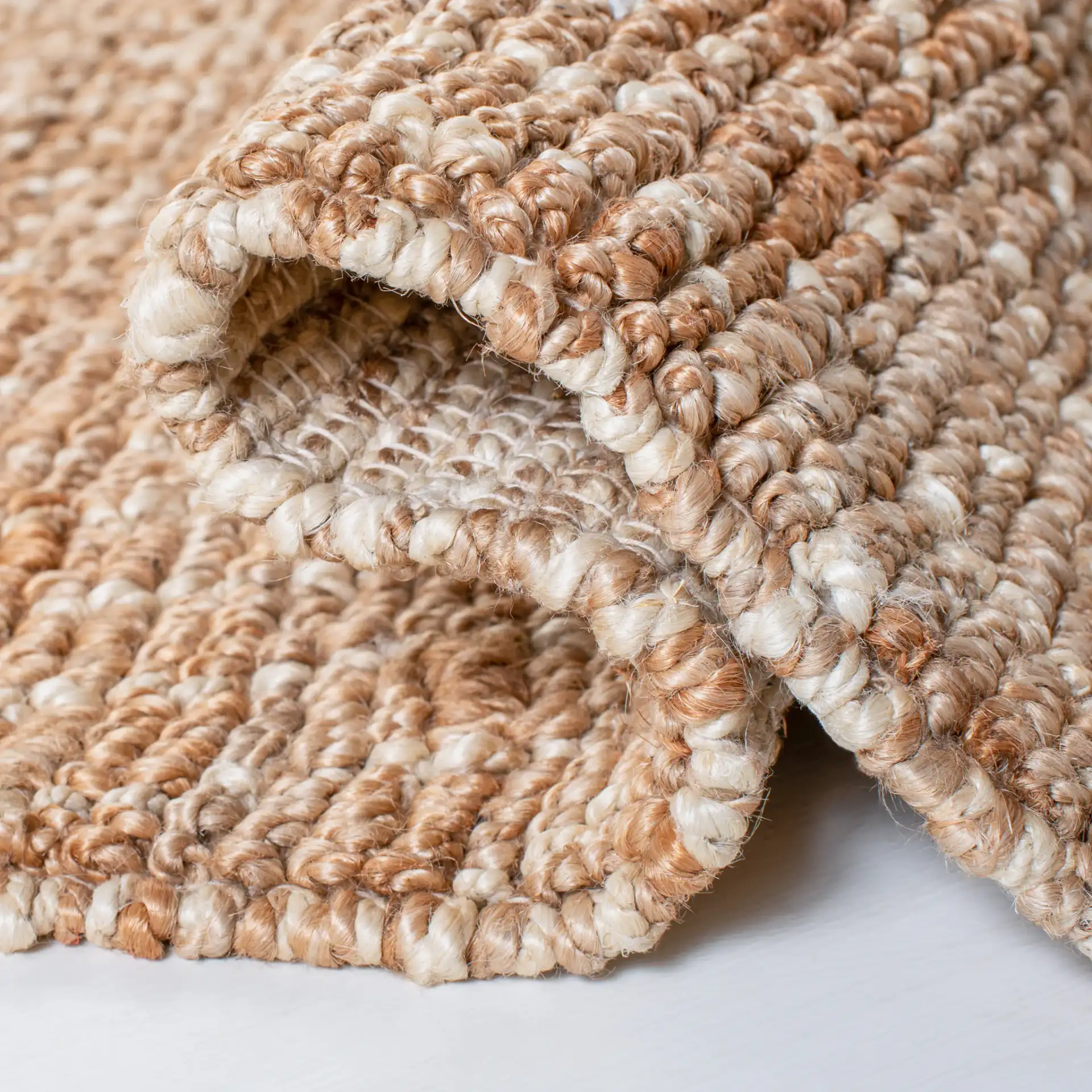 Bohemian Diamond Hand-Woven Jute Rug in Natural / Ivory in a styled room