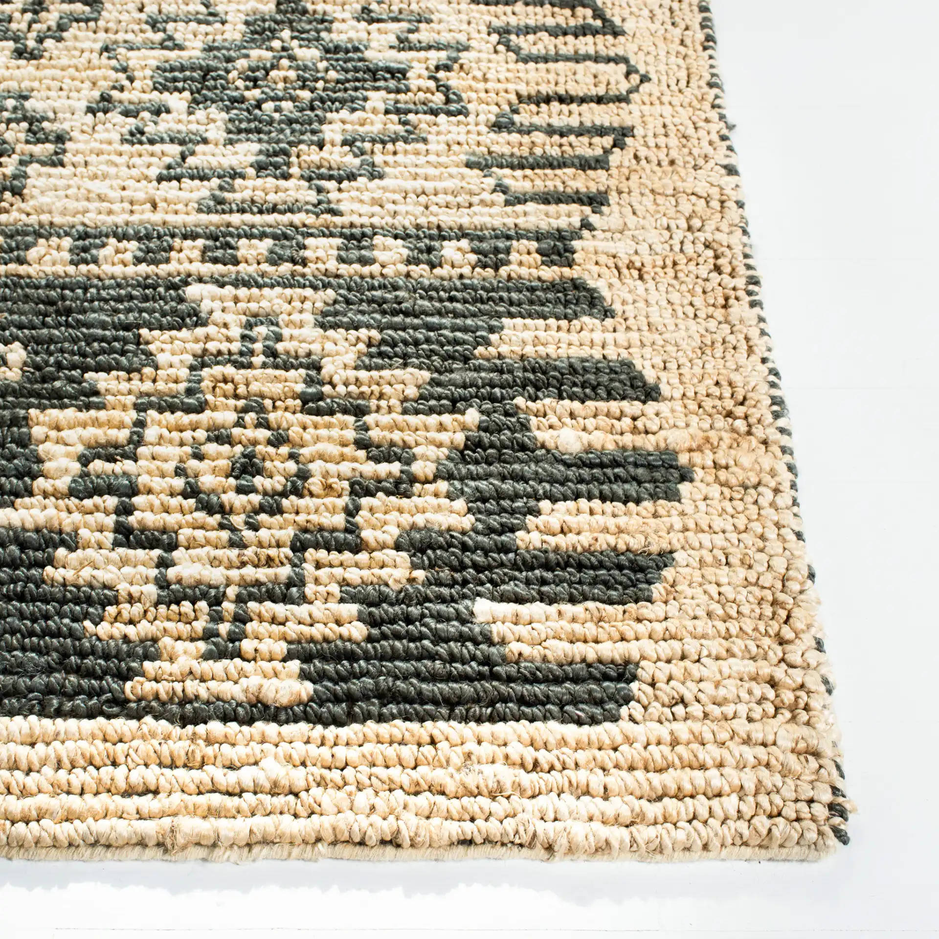 Bohemian Stepped Diamond Hand-Woven Jute Rug in Gray / Beige in a styled room