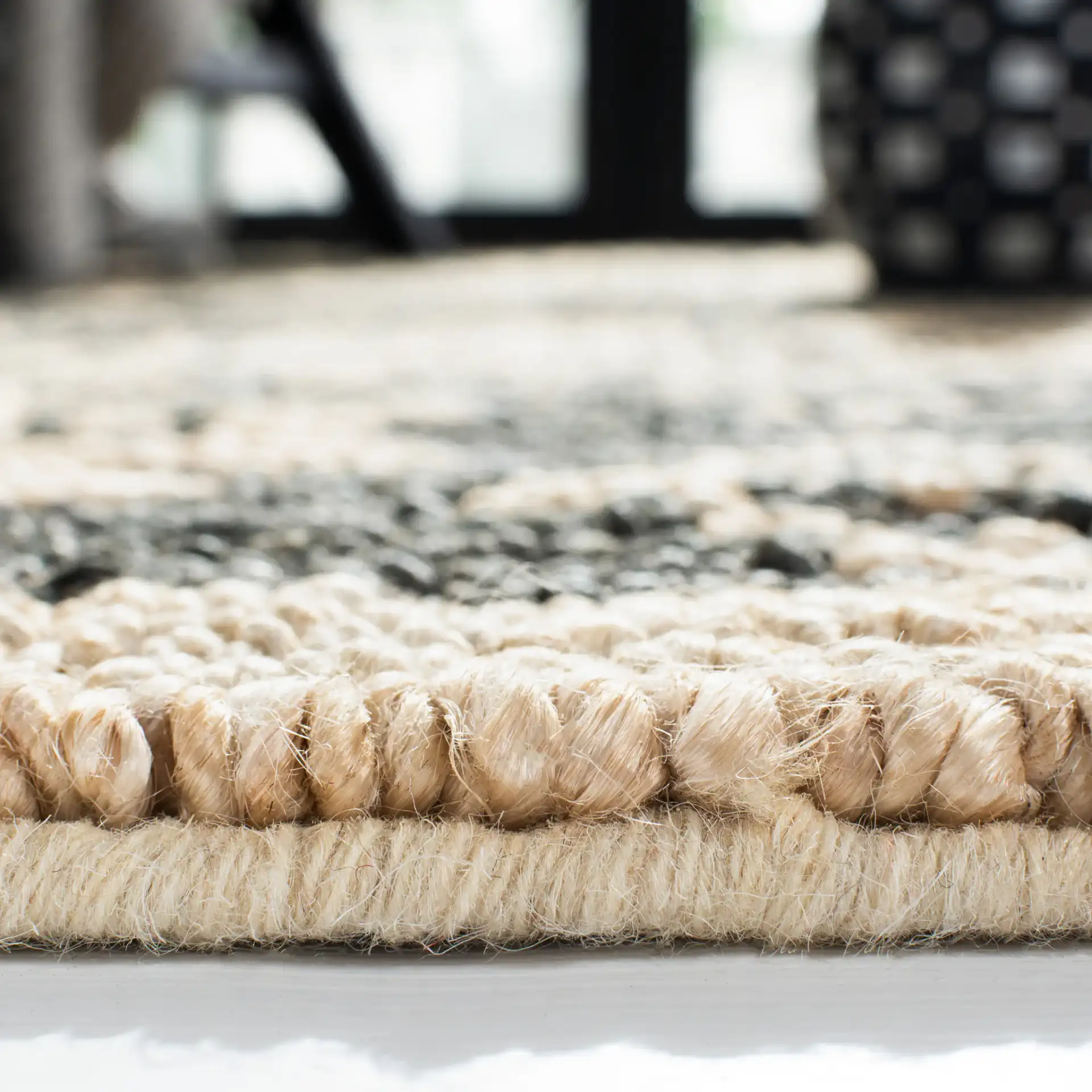 Bohemian Stepped Diamond Hand-Woven Jute Rug in Gray / Beige in a styled room