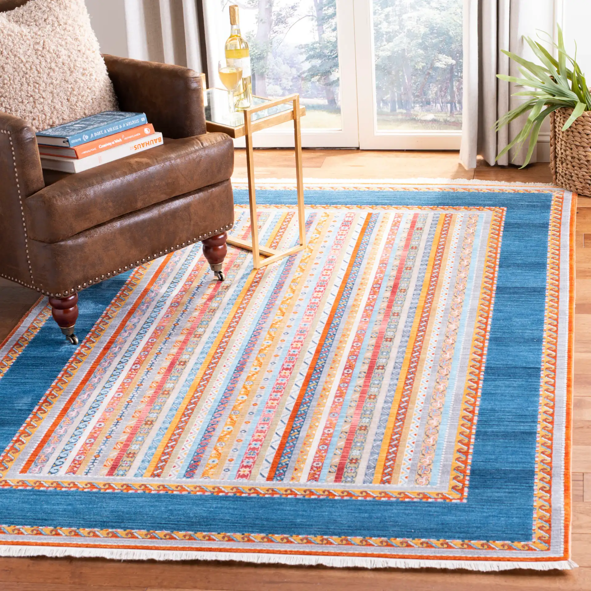 Bokhara Striped Border Rug in Blue / Orange in a styled room