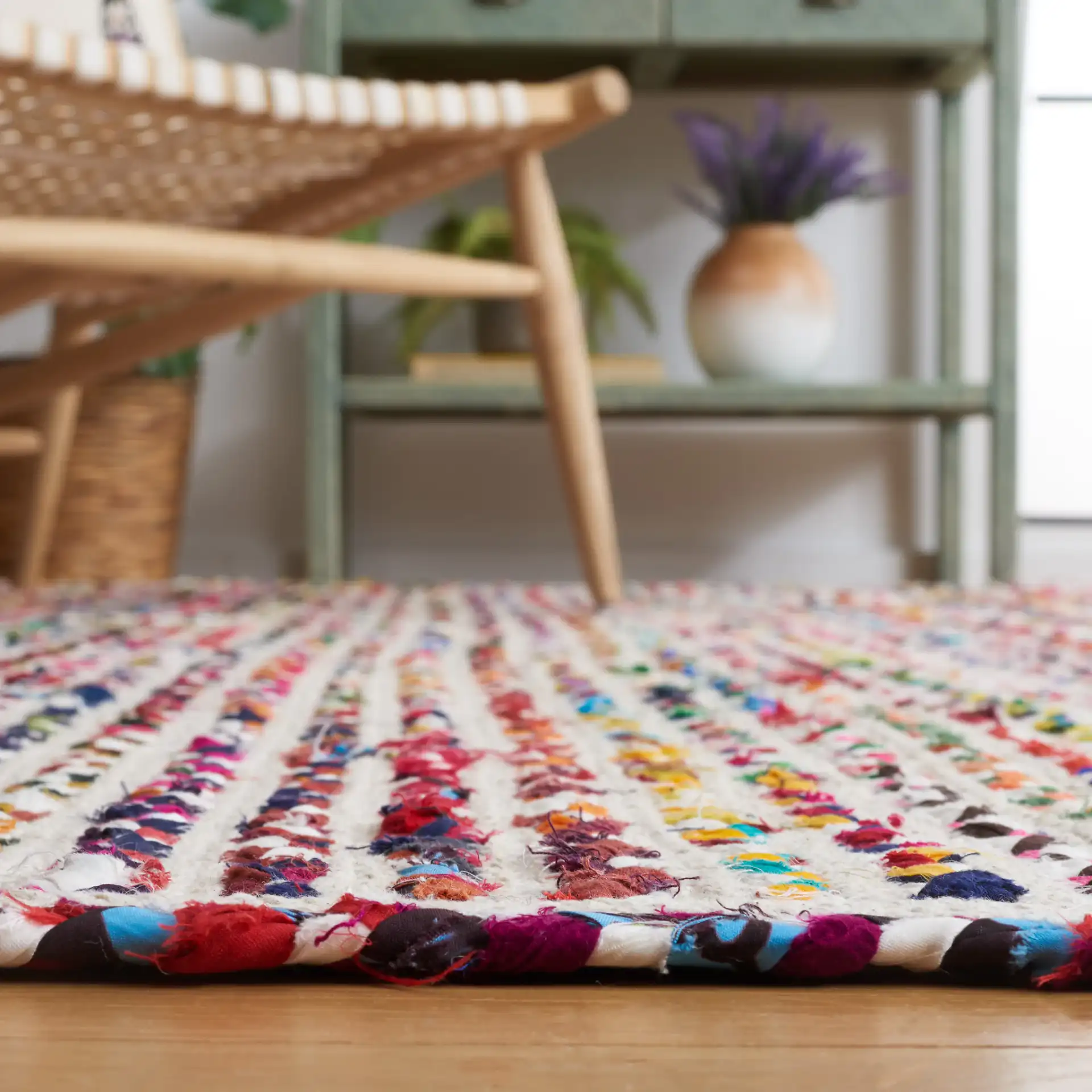 Braided Coastal Stripe Cotton Rug in Ivory / Multicolor in a styled room