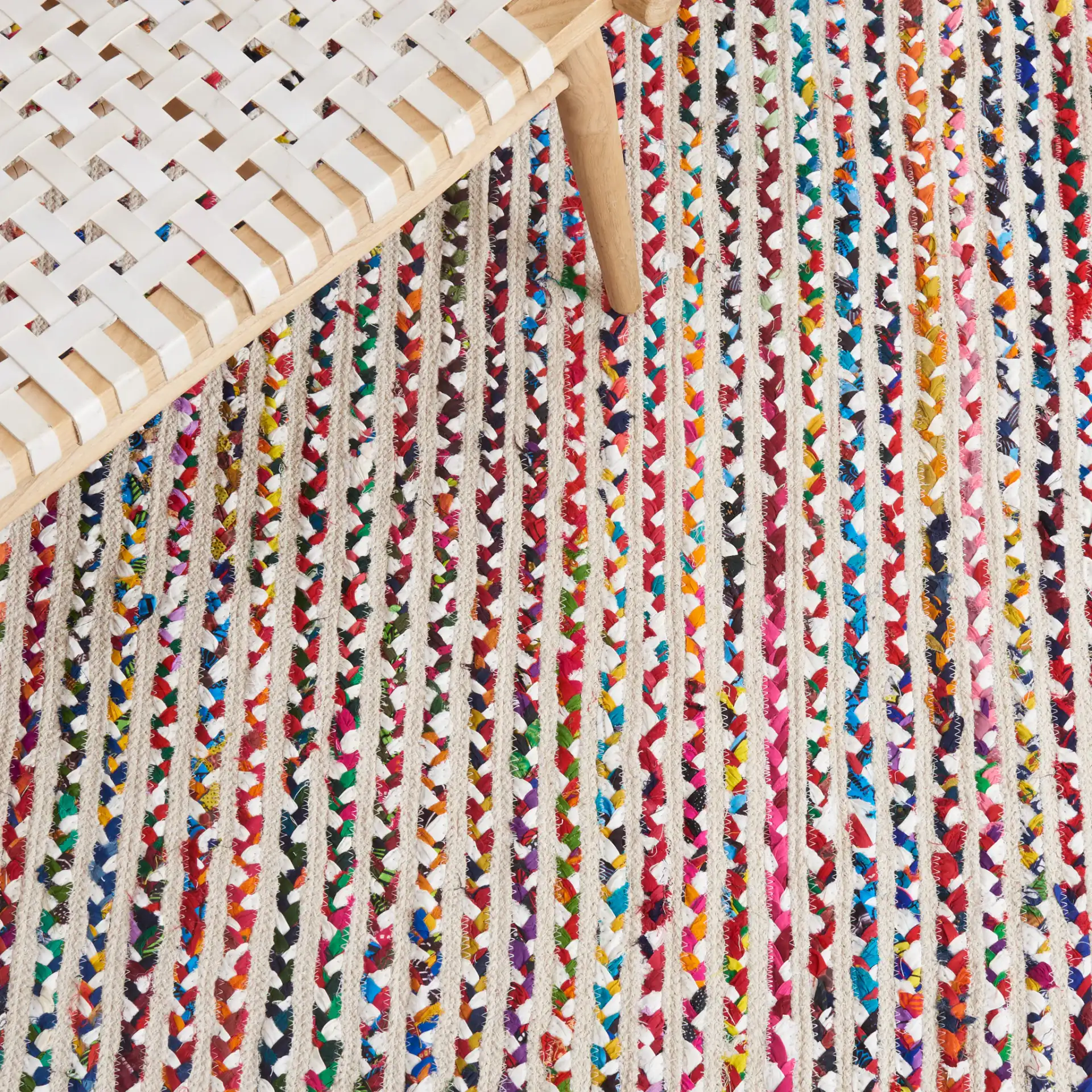 Braided Coastal Stripe Cotton Rug in Ivory / Multicolor in a styled room