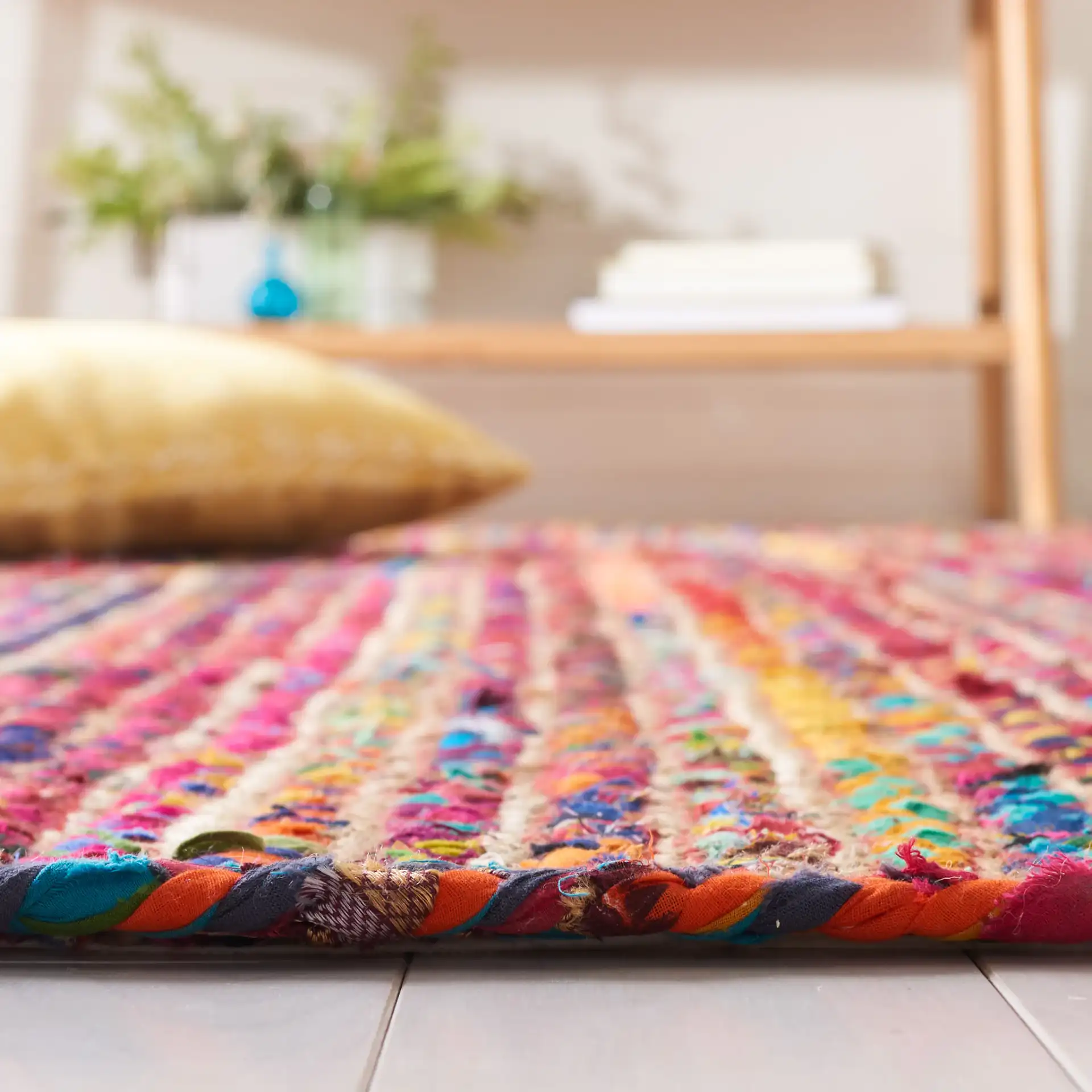 Braided Coastal Striped Jute Rug in Natural / Multicolor in a styled room