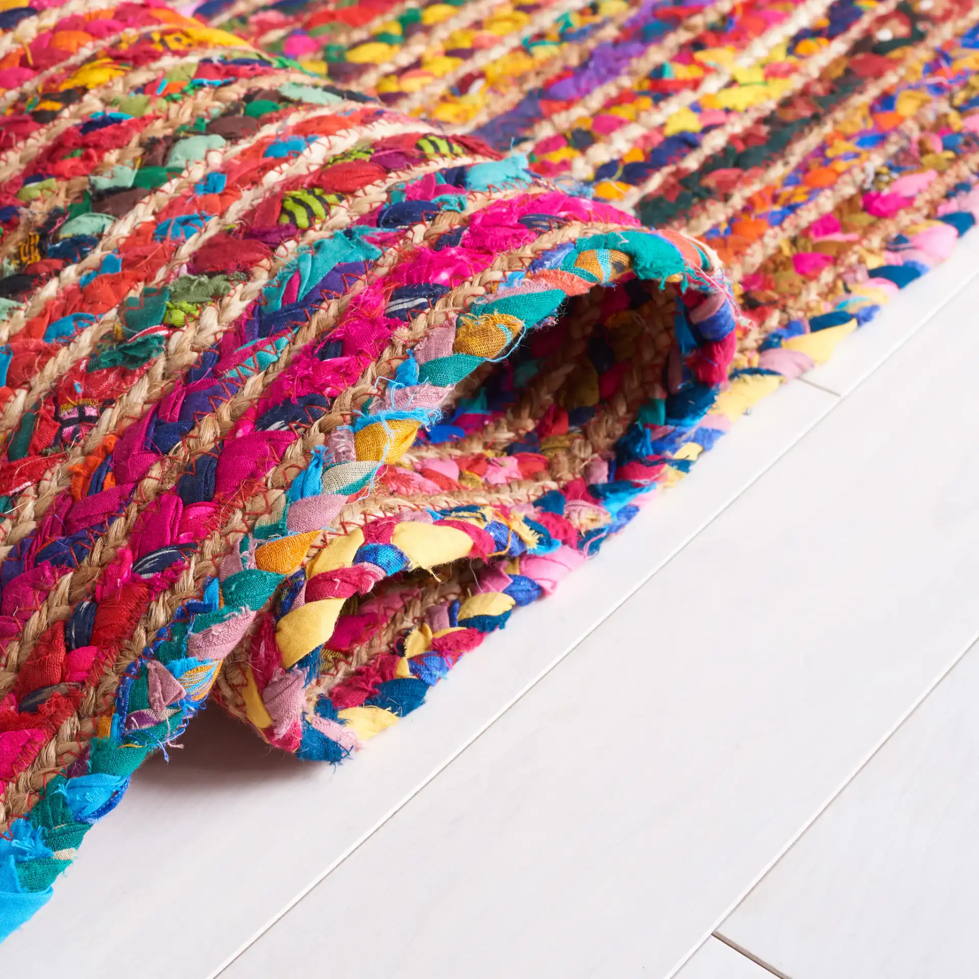 Braided Coastal Striped Jute Rug in Natural / Multicolor in a styled room