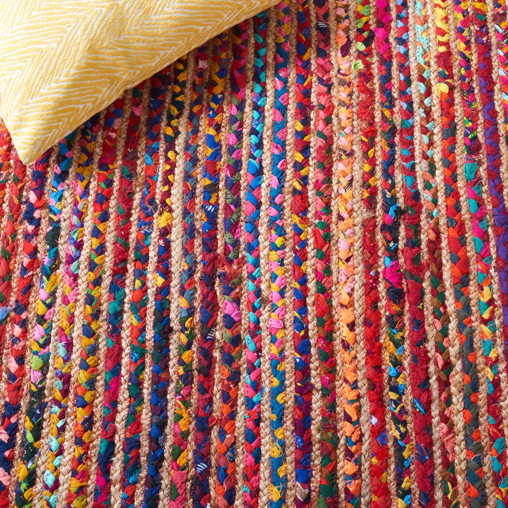 Braided Coastal Striped Jute Rug in Natural / Multicolor in a styled room