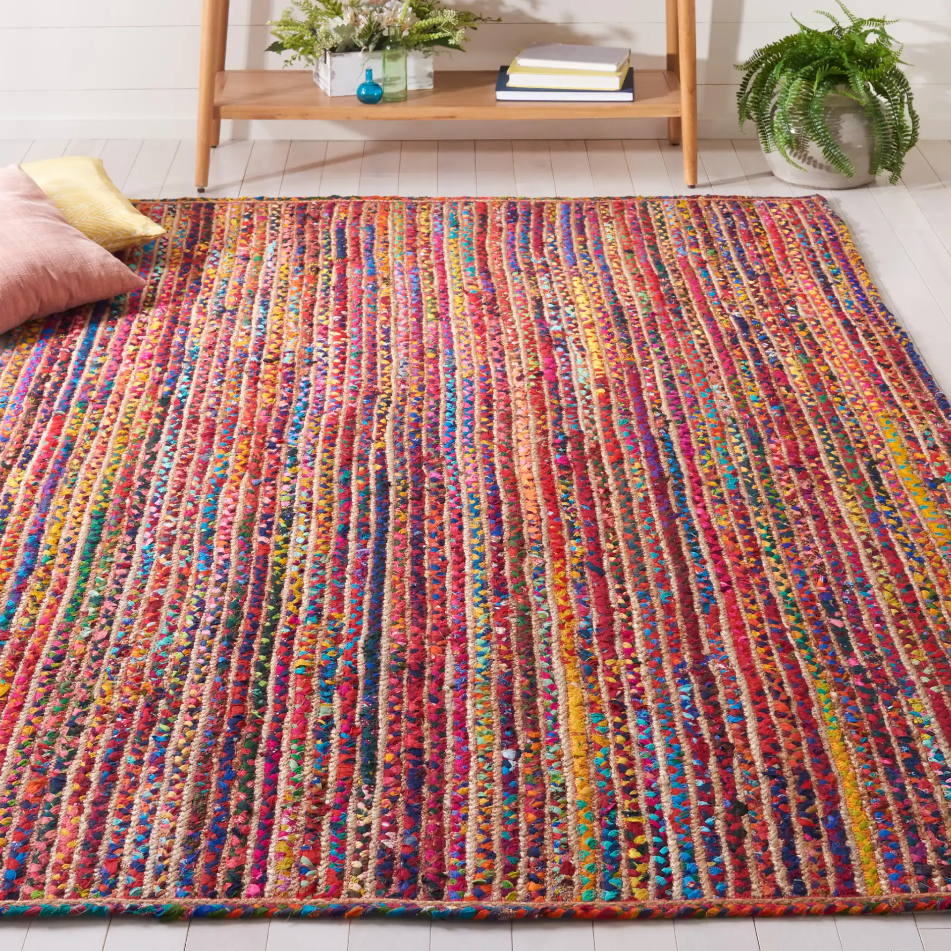 Braided Coastal Striped Jute Rug in Natural / Multicolor in a styled room