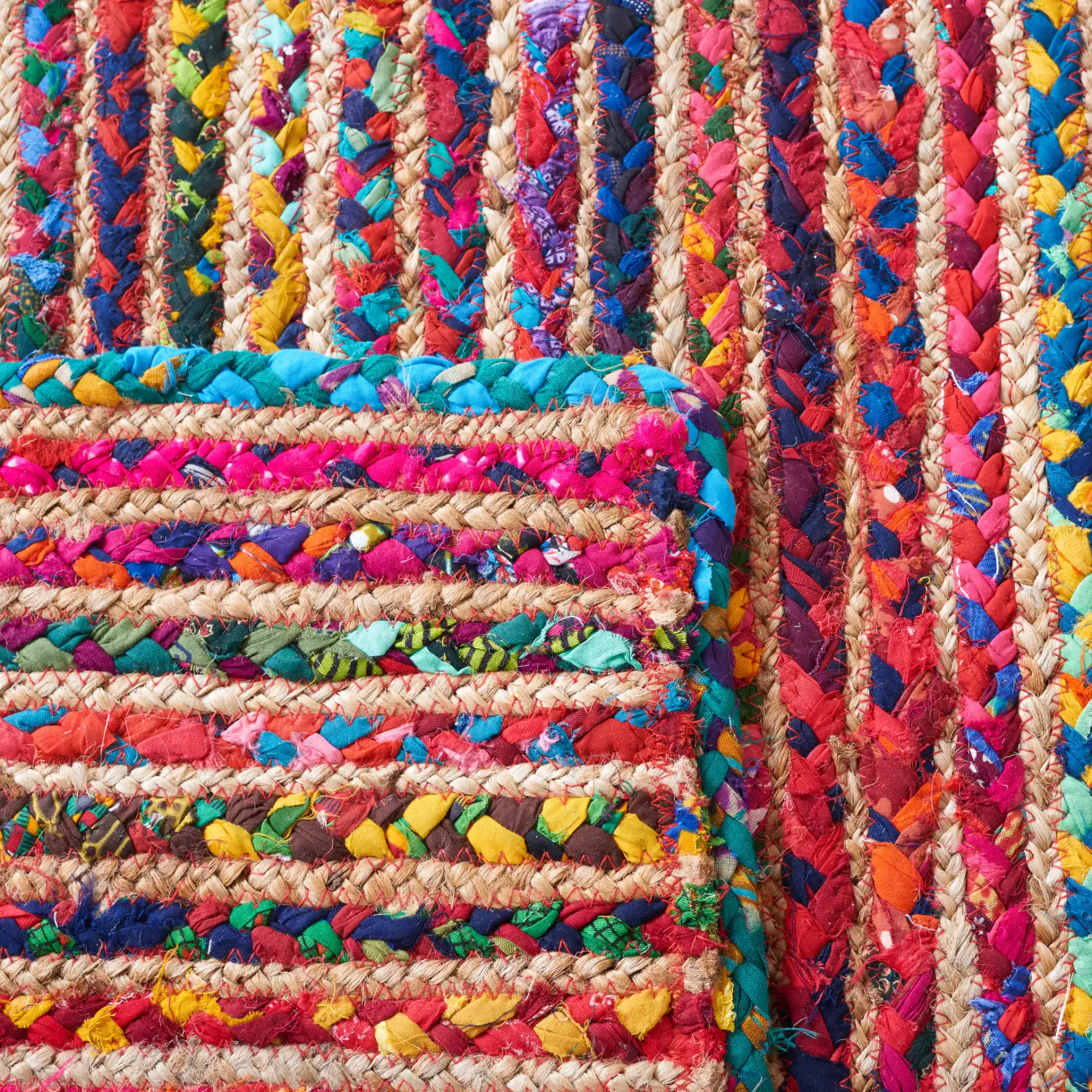 Braided Coastal Striped Jute Rug in Natural / Multicolor in a styled room