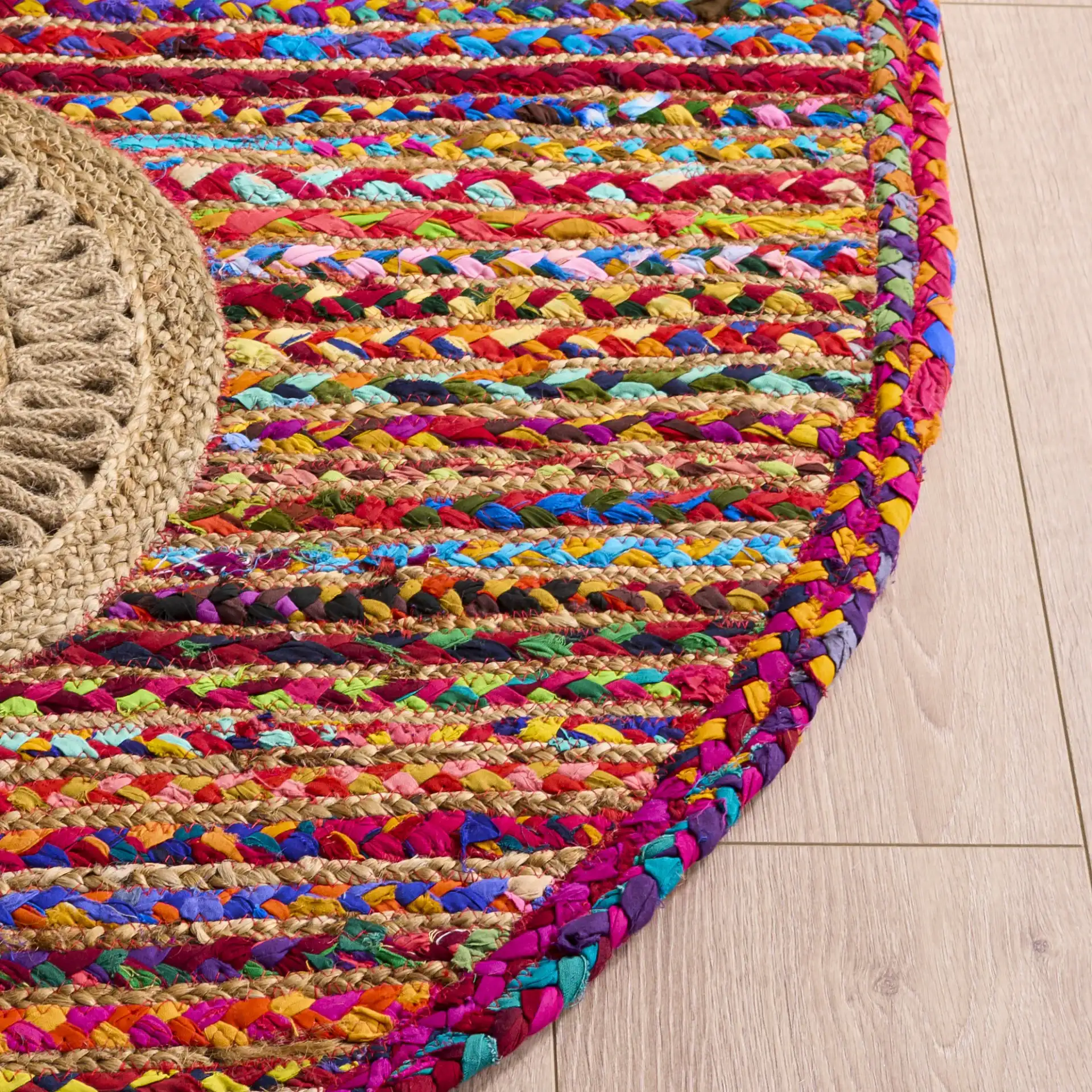 Braided Coastal Geometric Cotton & Jute Hand-Woven Rug in Pink / Sage in a styled room