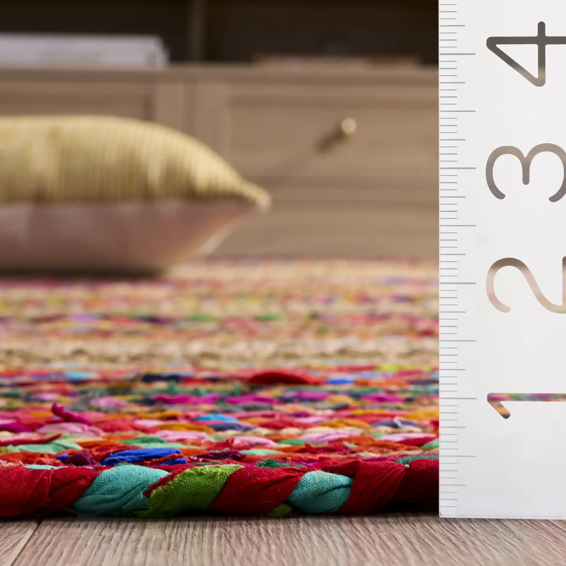 Braided Coastal Geometric Cotton & Jute Hand-Woven Rug in Pink / Sage in a styled room