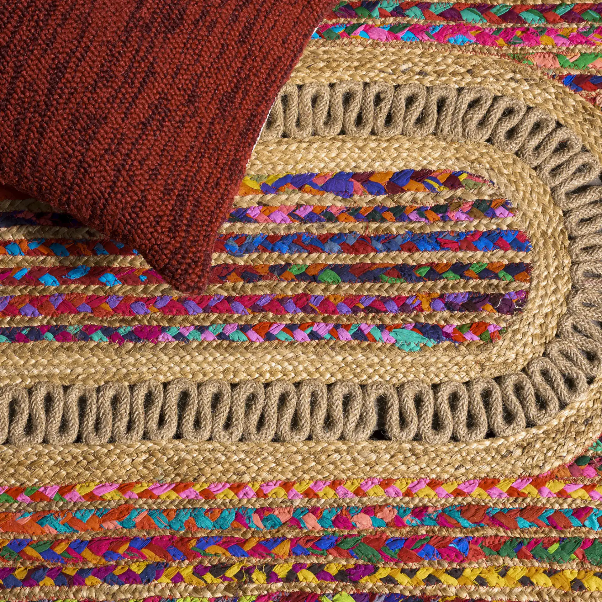 Braided Coastal Geometric Cotton & Jute Hand-Woven Rug in Pink / Sage in a styled room