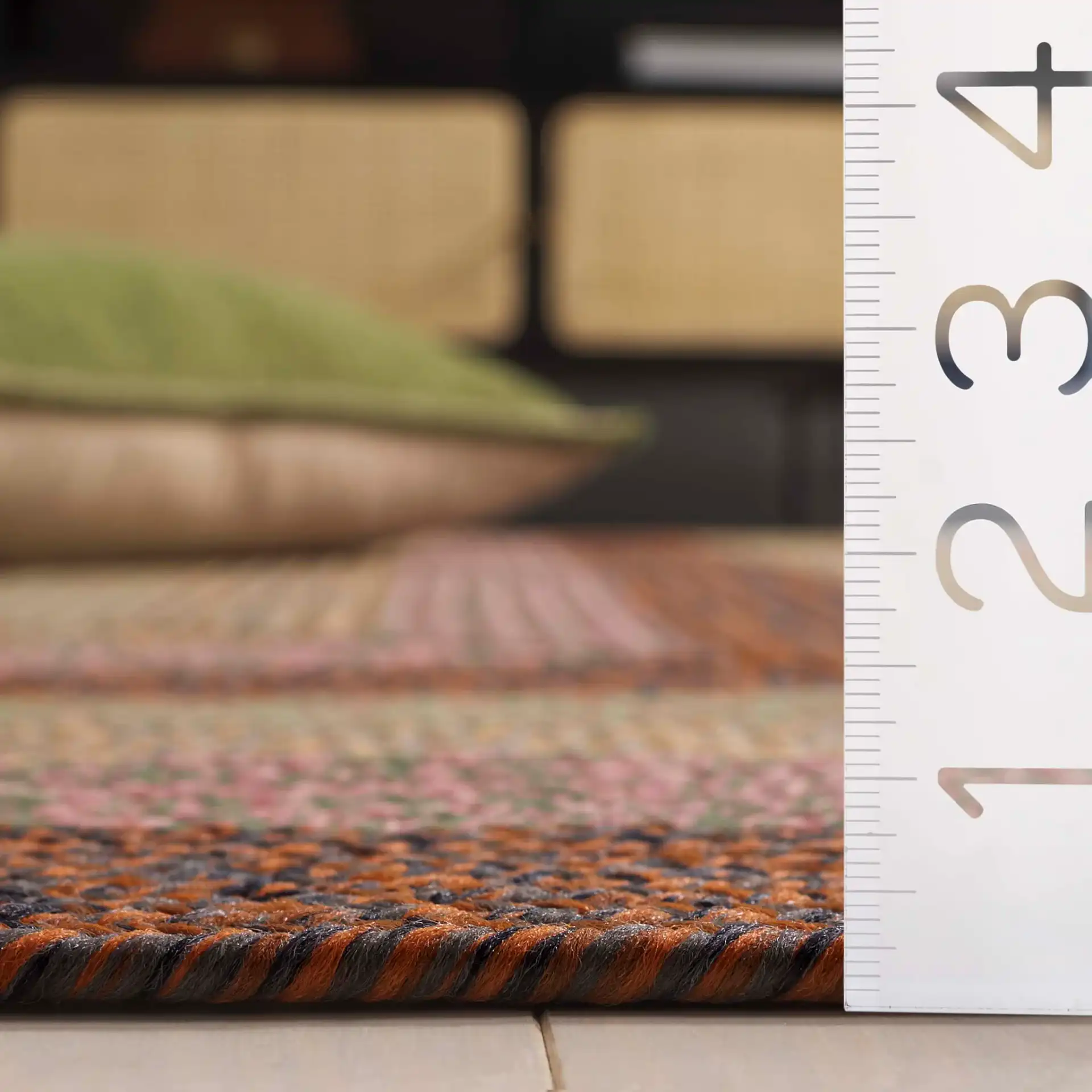 Braided Oval Band Washable Outdoor Rug in Dark Brown / Light Green in a styled room