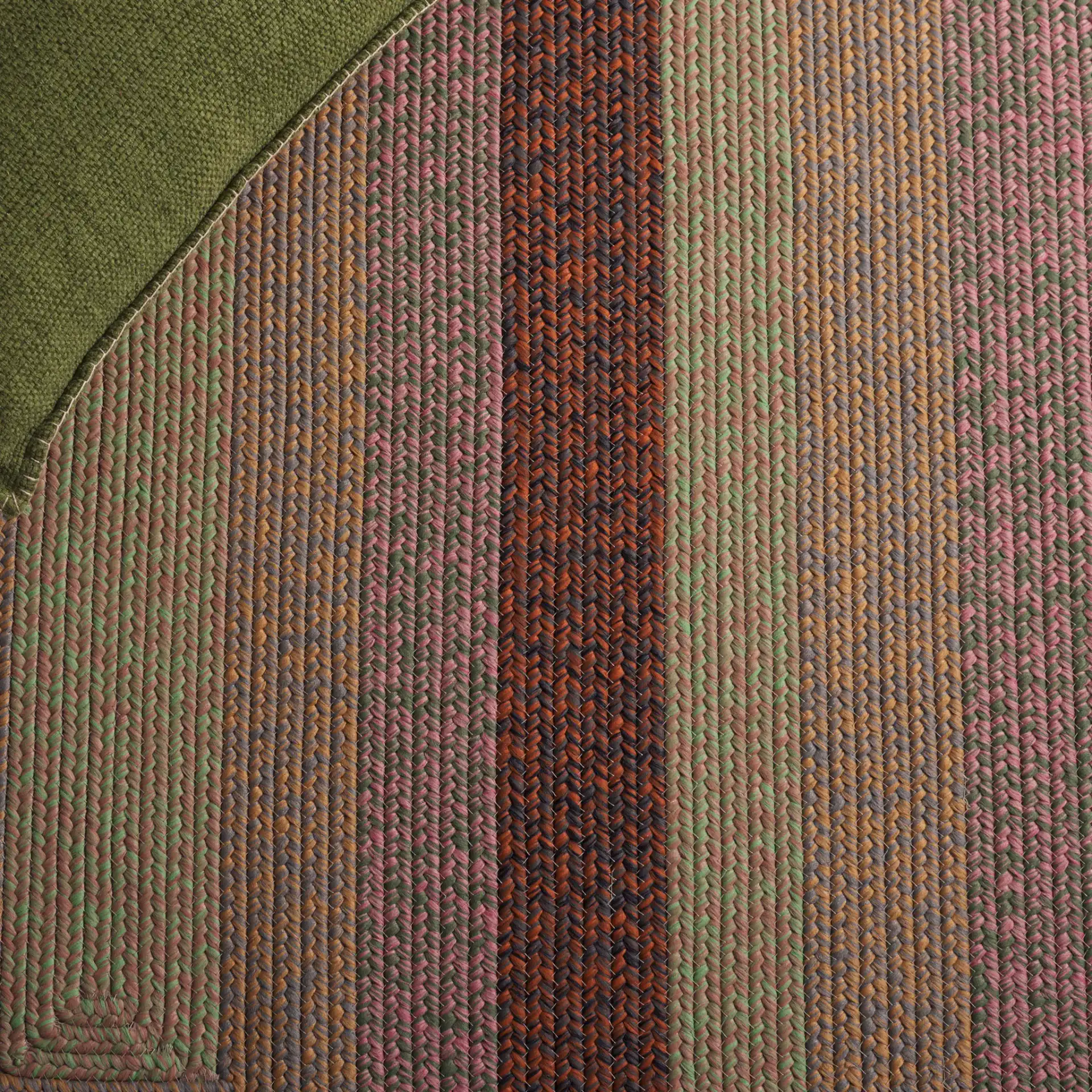 Braided Oval Band Washable Outdoor Rug in Dark Brown / Light Green in a styled room