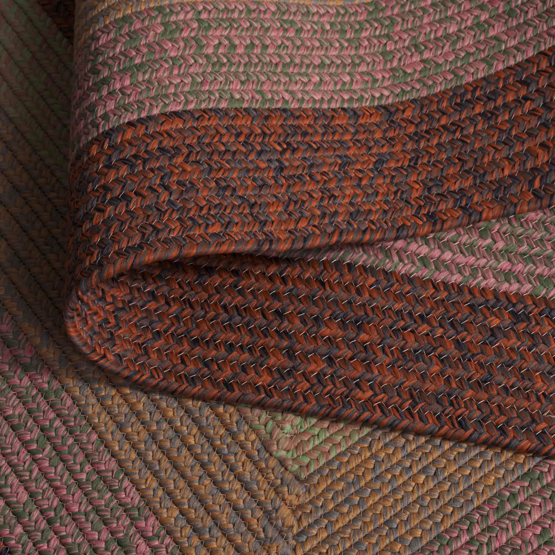 Braided Oval Band Washable Outdoor Rug in Dark Brown / Light Green in a styled room