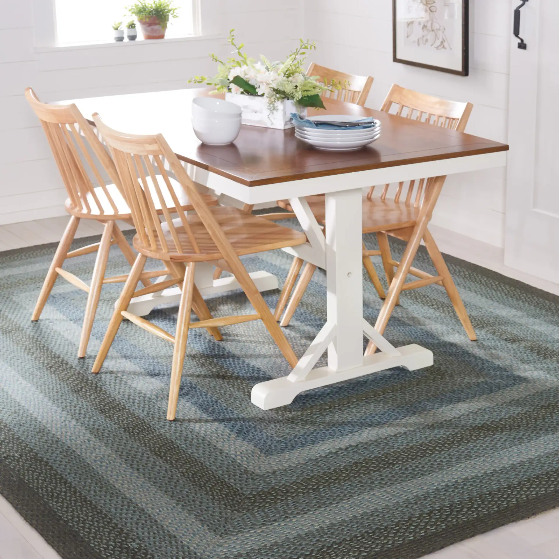 Braided Coastal Geometric Jute Rug in Light Blue / Green in a styled room