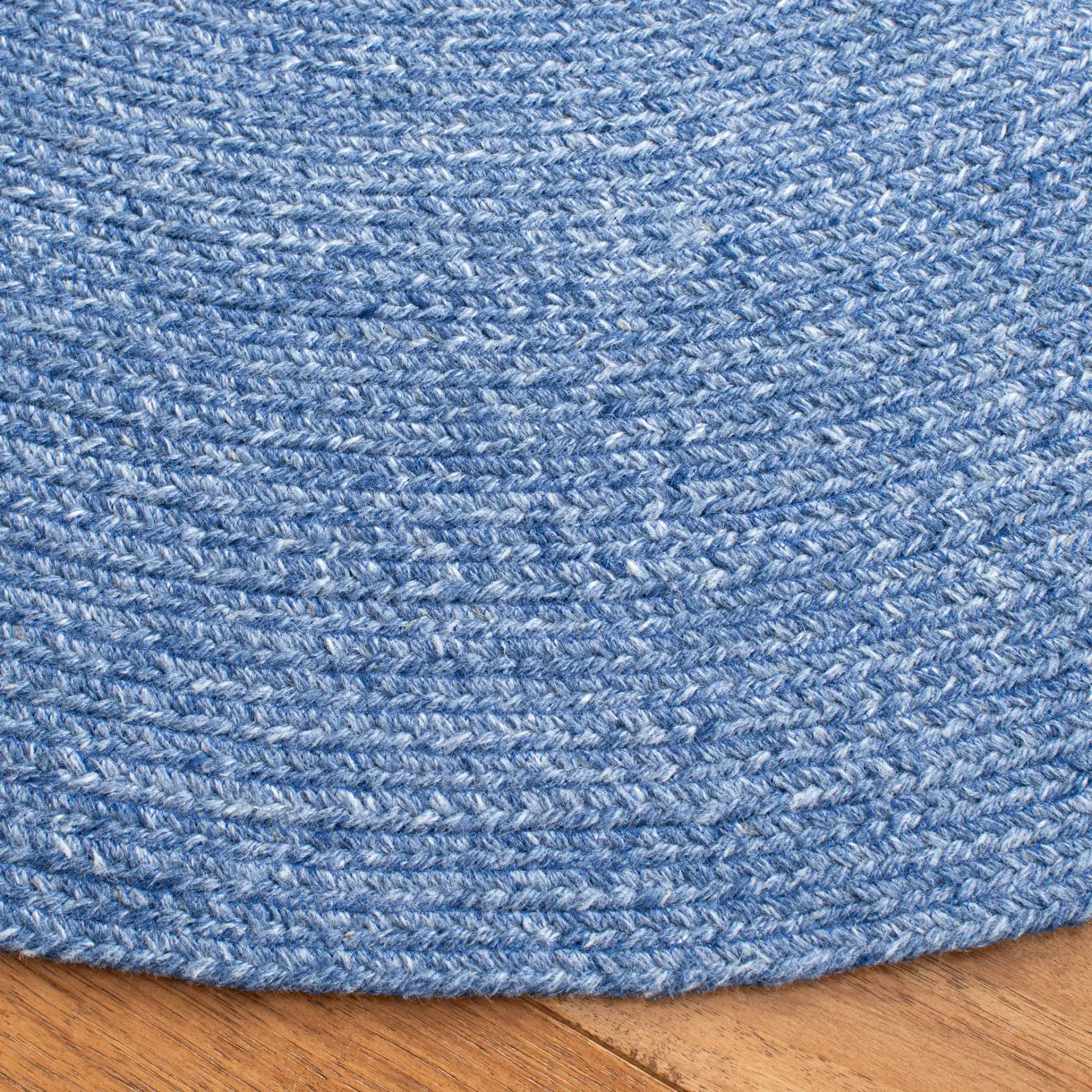 Braided Farmhouse Solid Hand-Woven Rug in Blue in a styled room