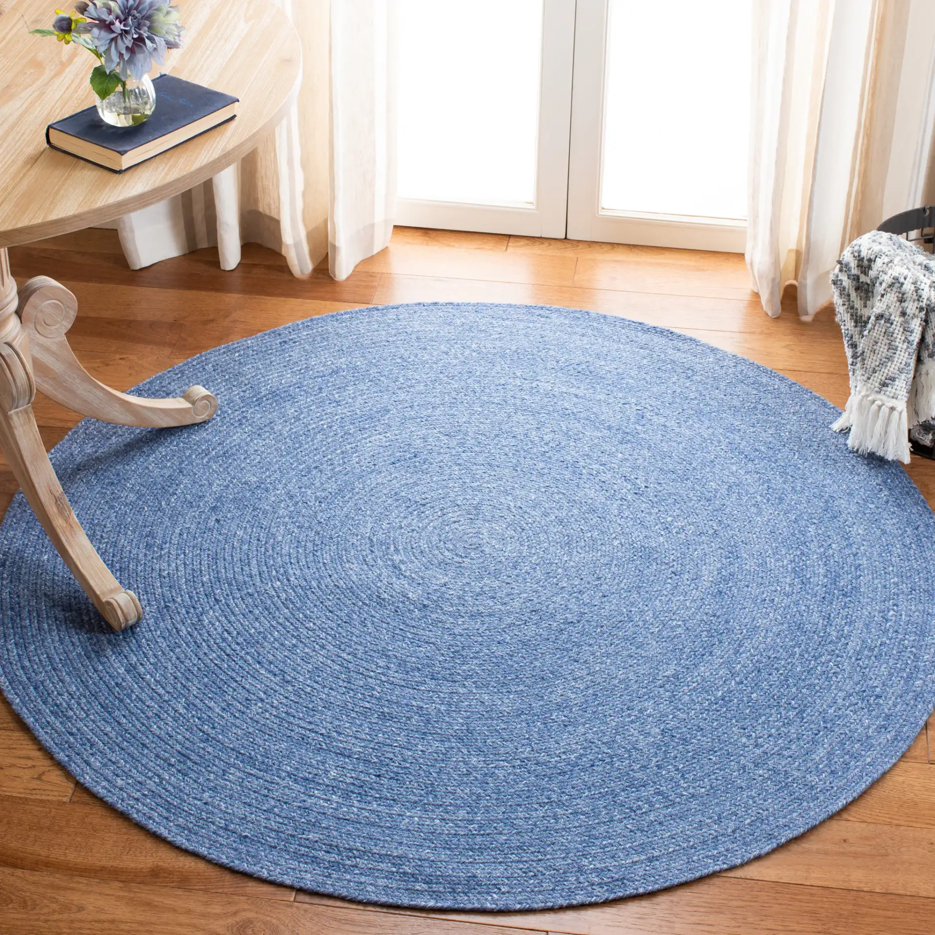 Braided Farmhouse Solid Hand-Woven Rug in Blue in a styled room