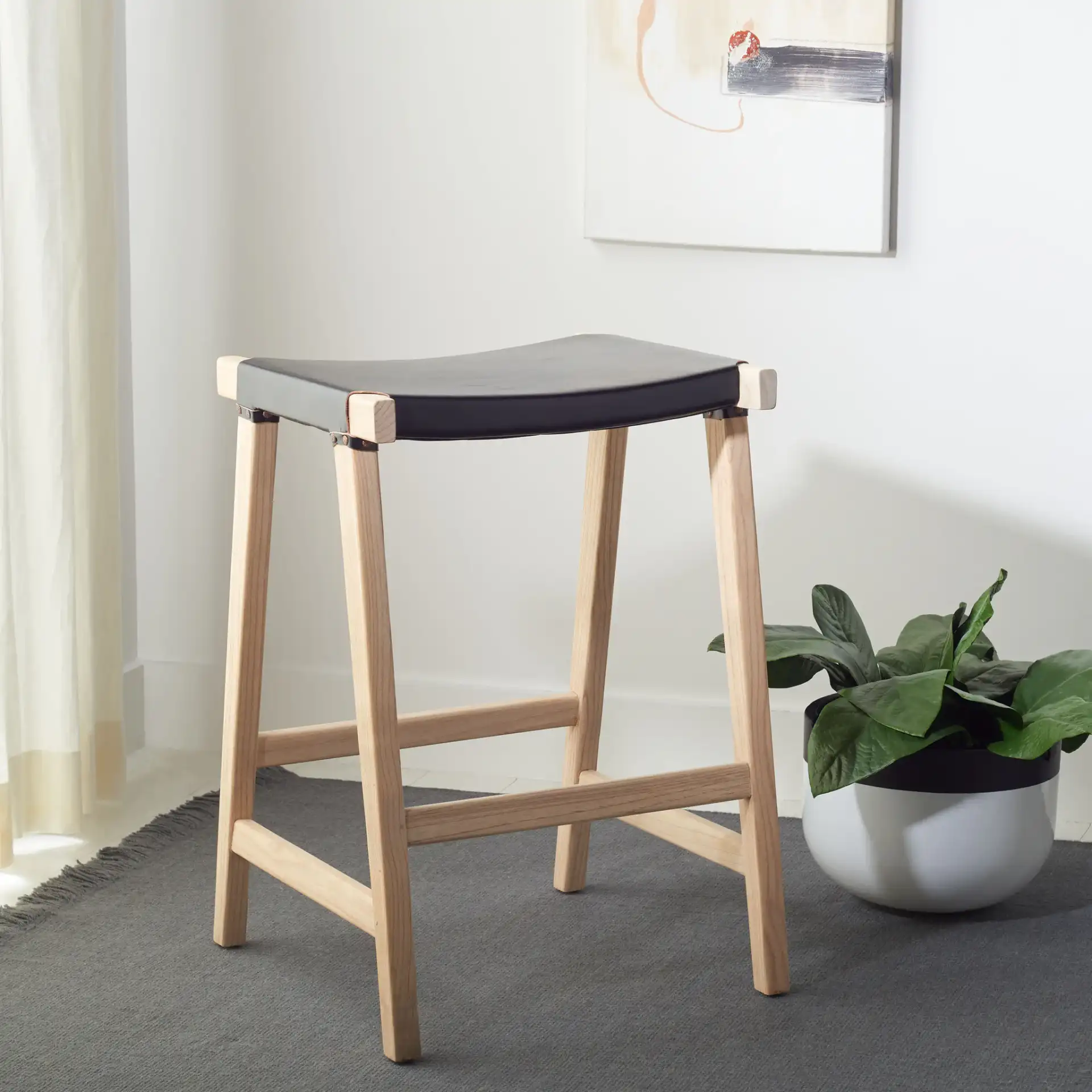 Aariz Rectangle Counter Stool in Black / Natural in a styled room