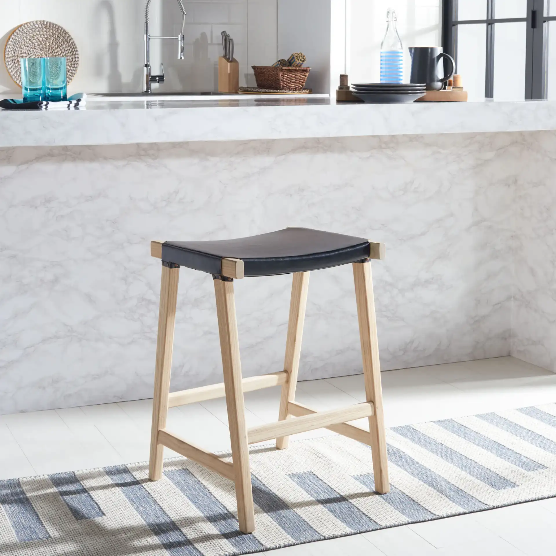 Aariz Rectangle Counter Stool in Black / Natural in a styled room