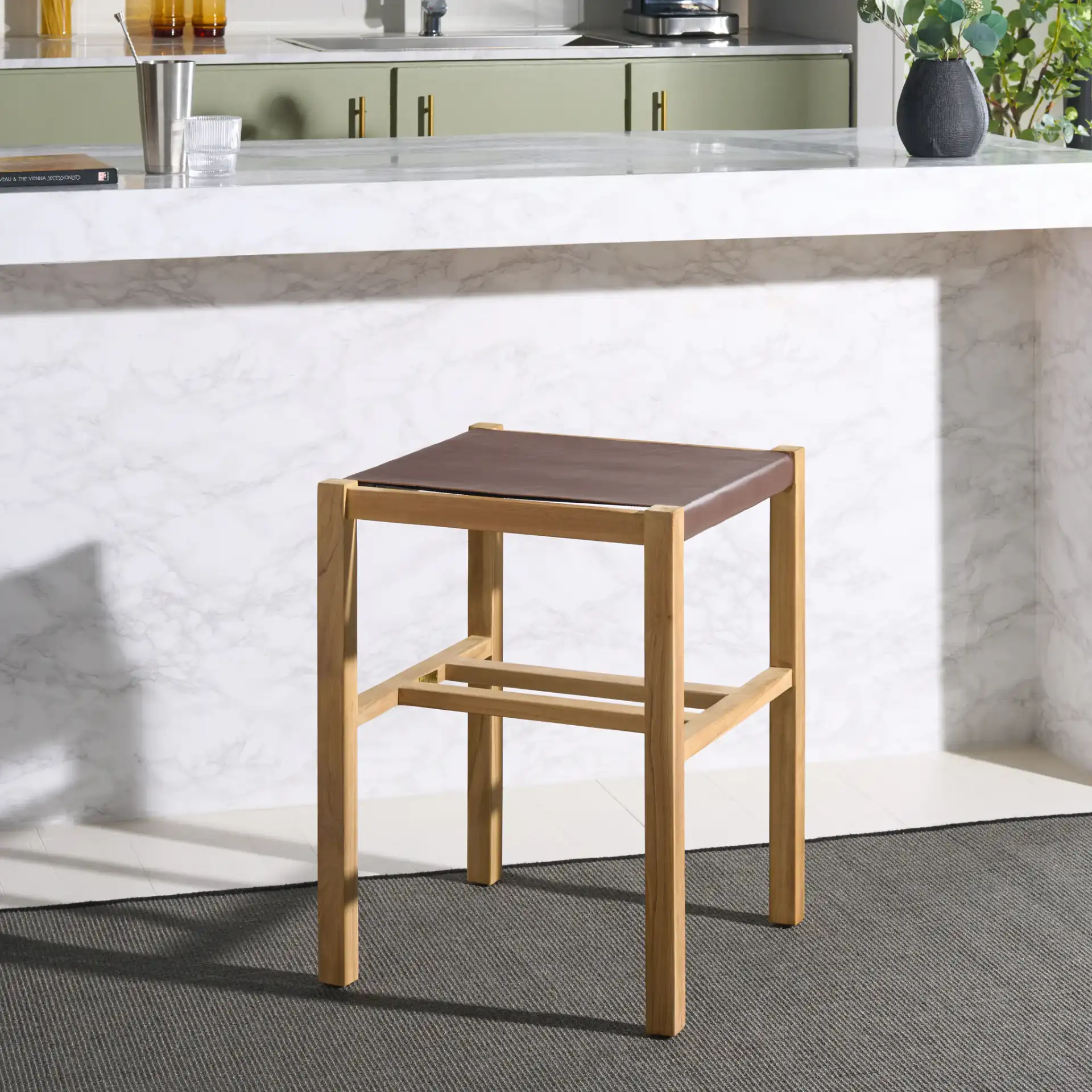 Solana Counter Stool in Cognac / Natural in a styled room