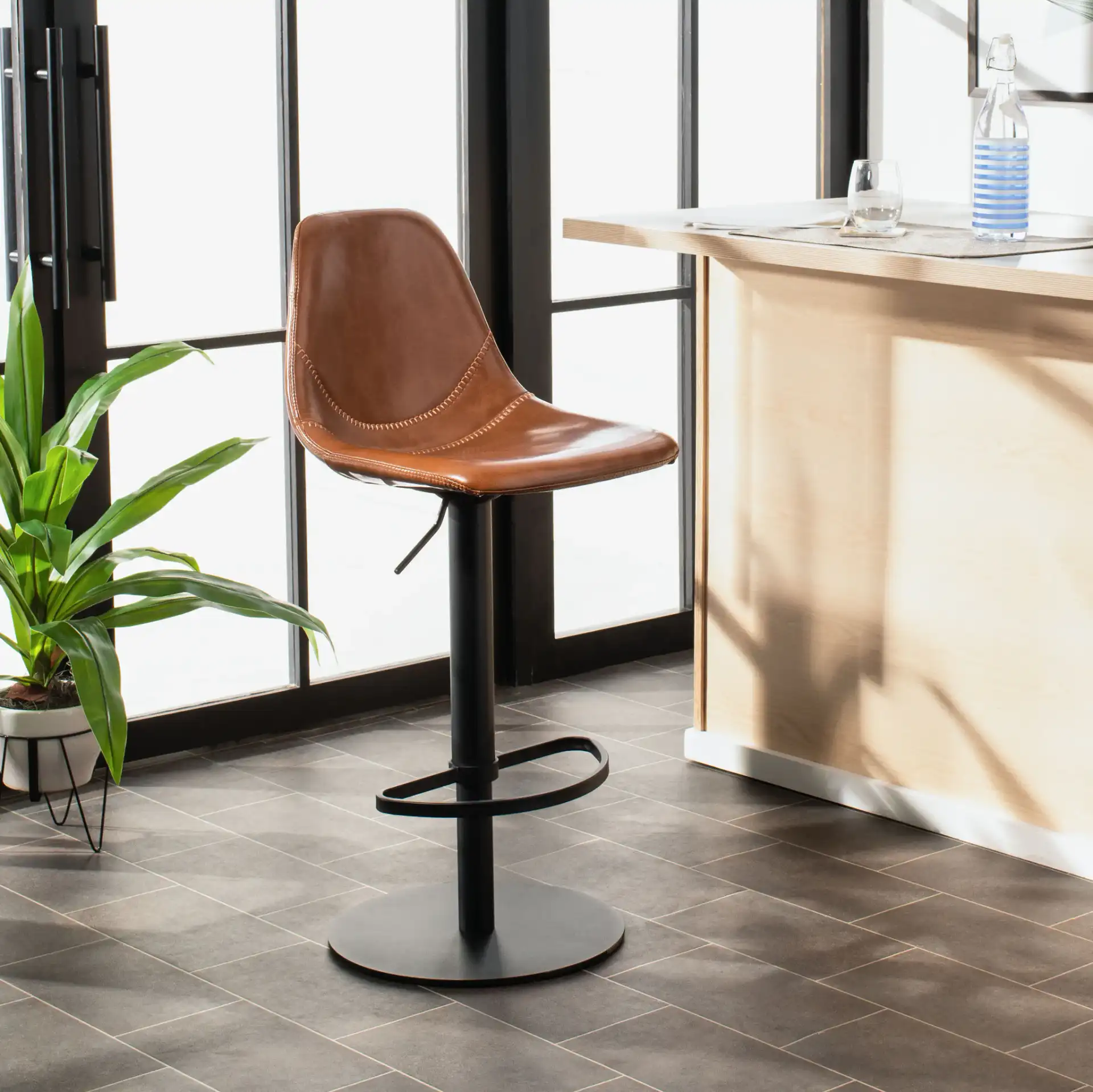Sky Adjustable Swivel Barstool in Olive Pu / Black in a styled room