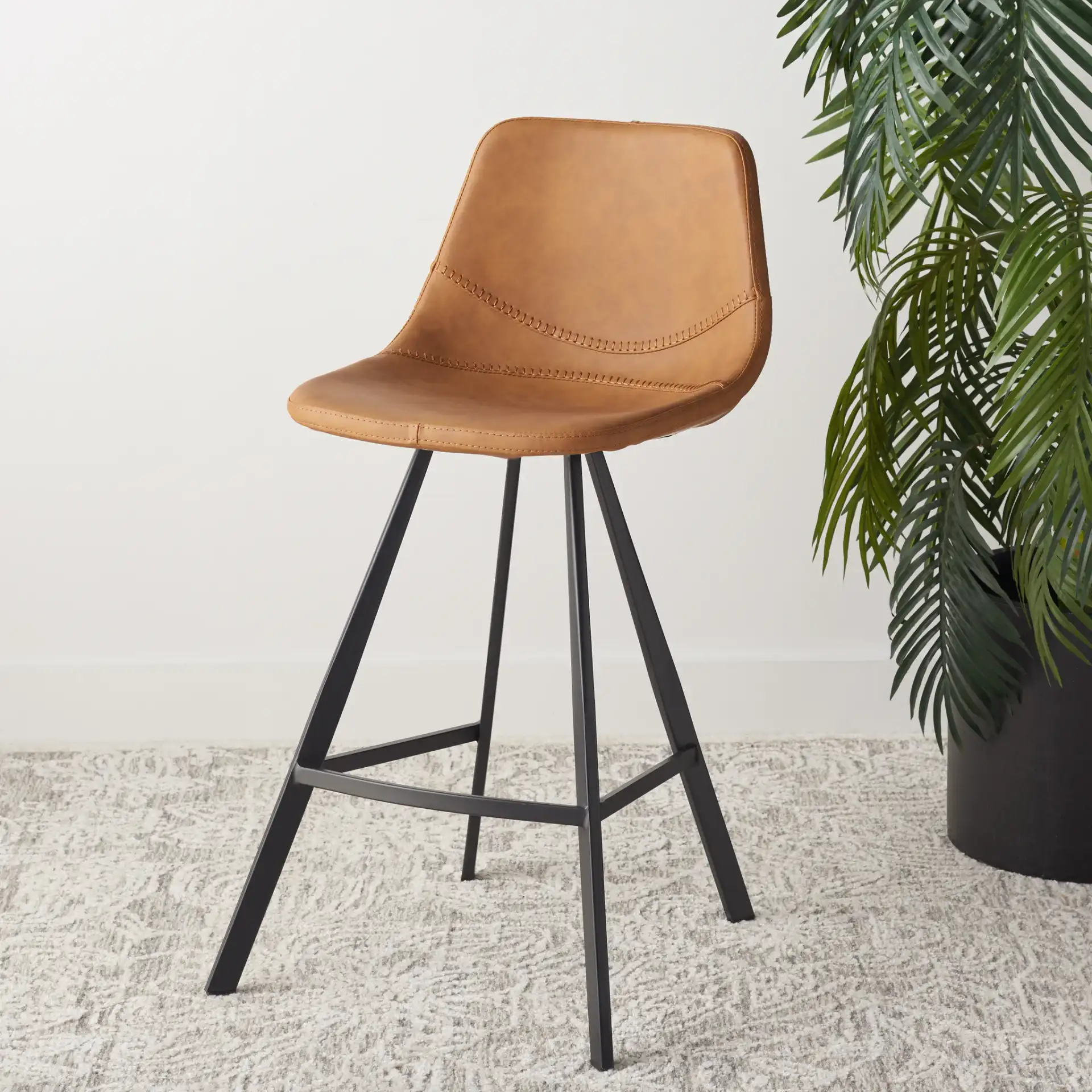 Ryanne Counter Stool in Cognac / Black in a styled room