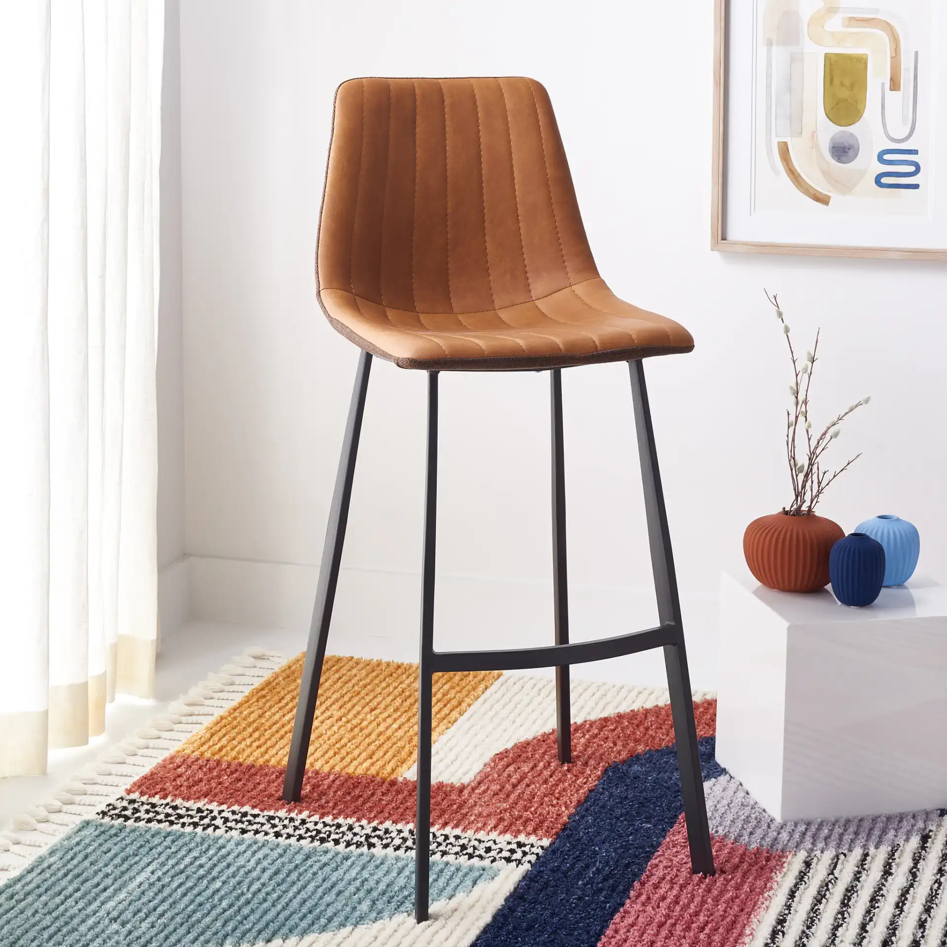 Rhyatte Bar Stool in Gray / Black in a styled room