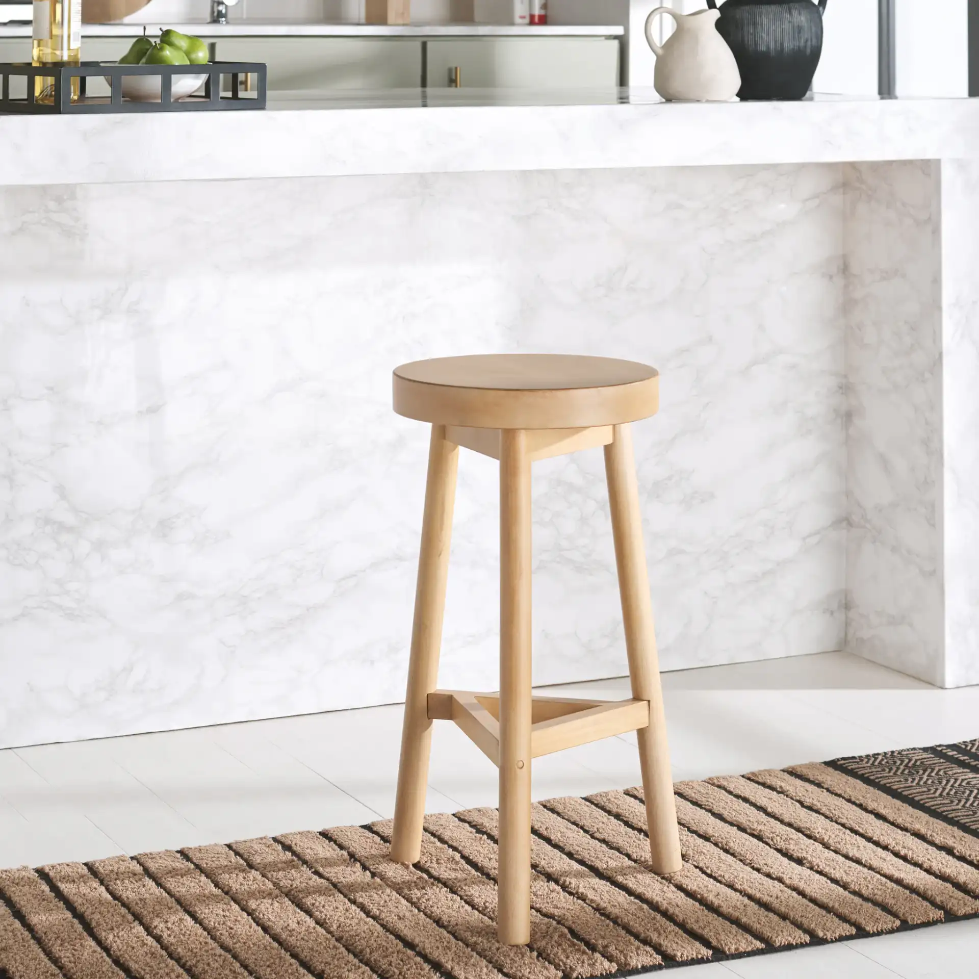 Andrius Counter Stool in Natural in a styled room