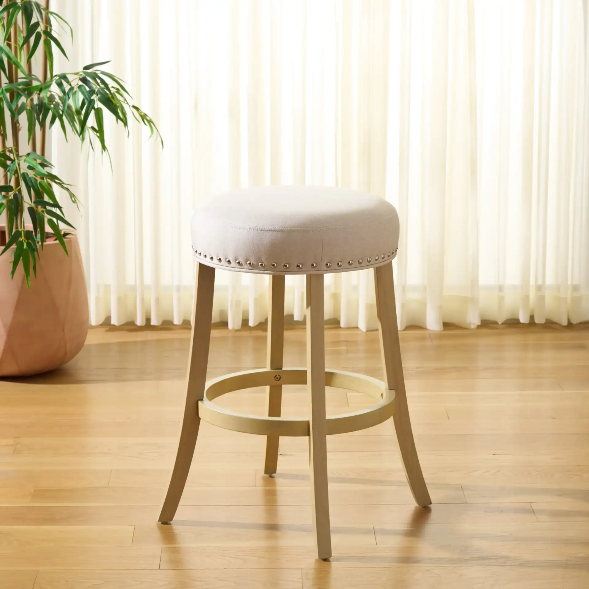 Amato Counter Stool in Cream / Natural in a styled room