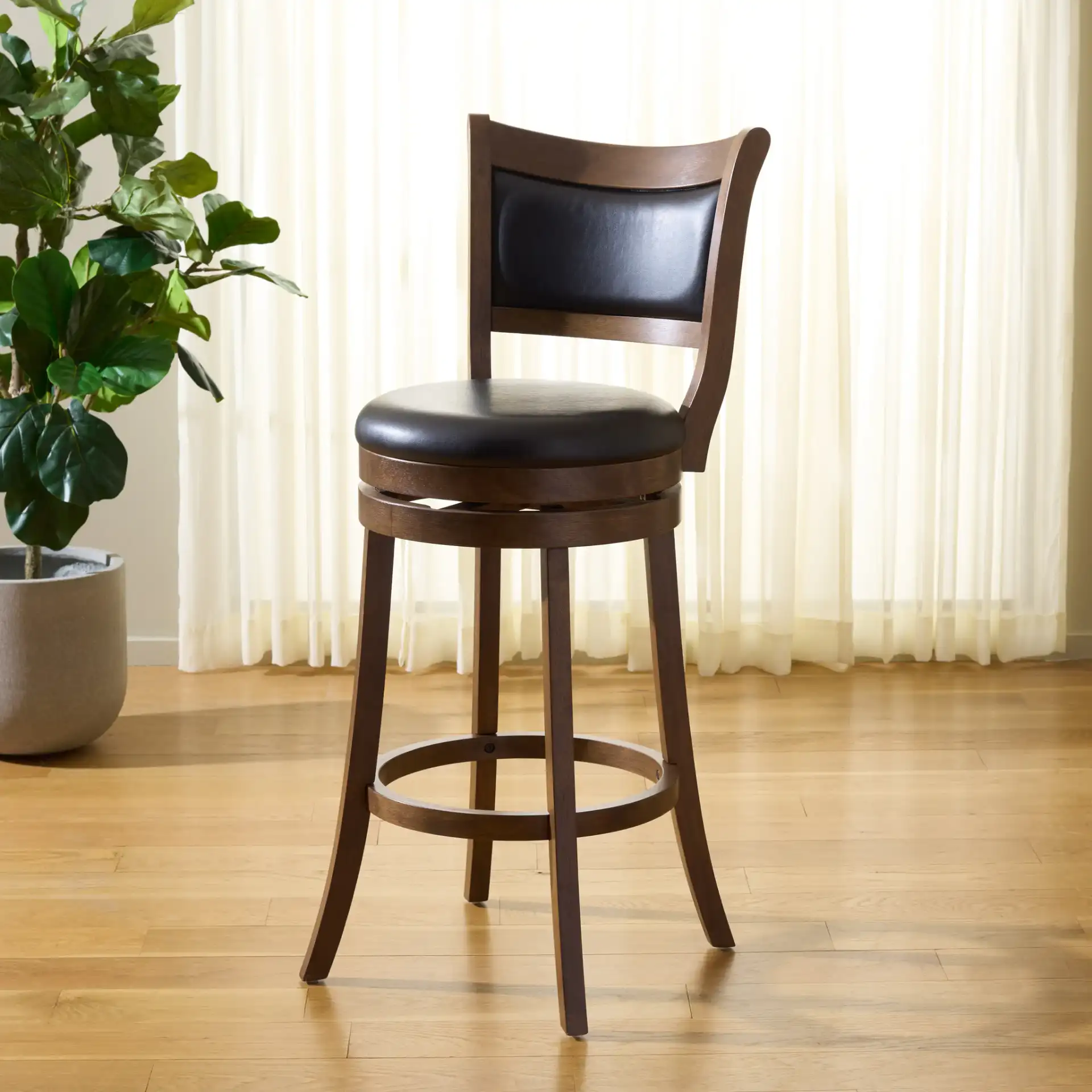 Takado Barstool in Black / Natural in a styled room