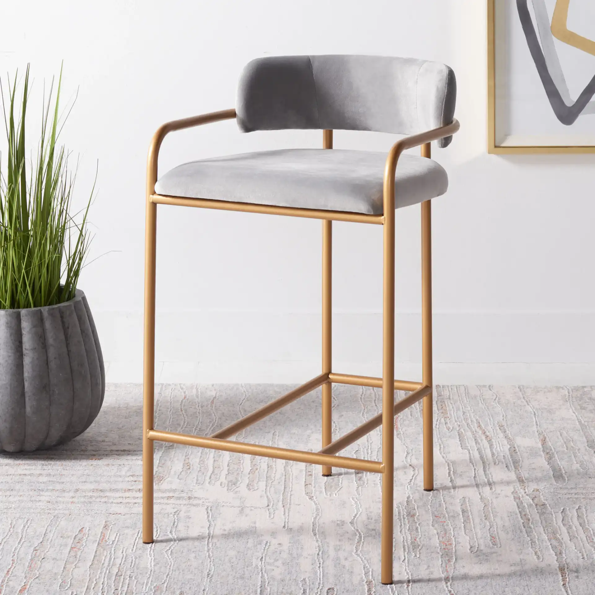 Camille Counter Stool in Dark Gray / Gold in a styled room