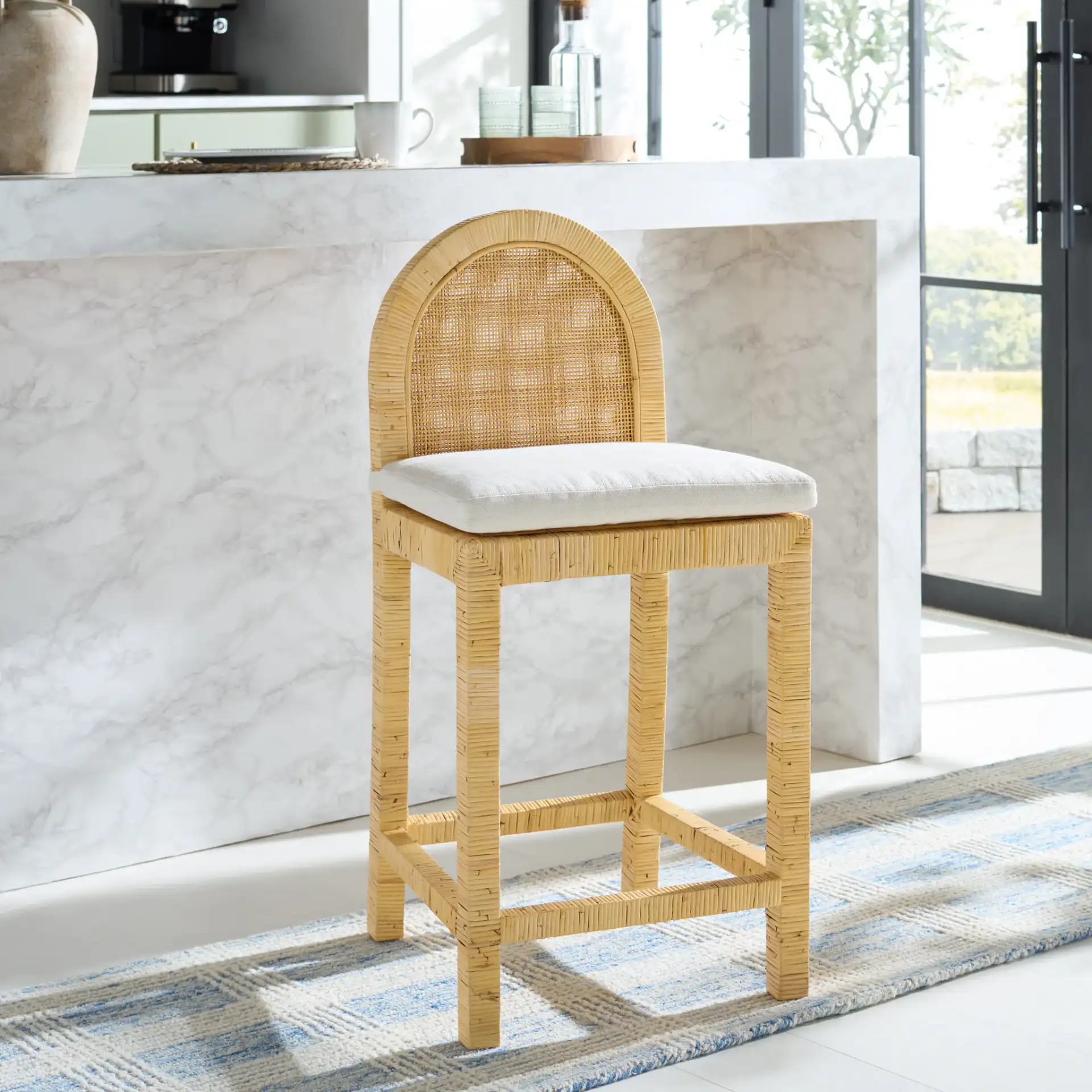Tojo Cane Roundback Counter Stool in Natural / White in a styled room