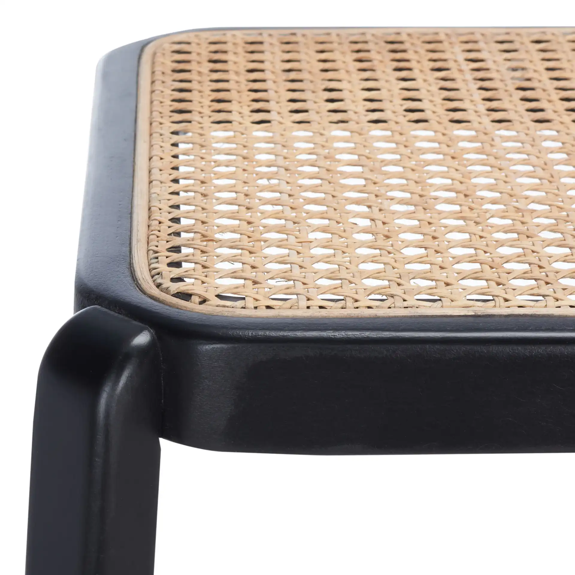 Silus Backless Cane Bar Stool in Black / Natural in a styled room
