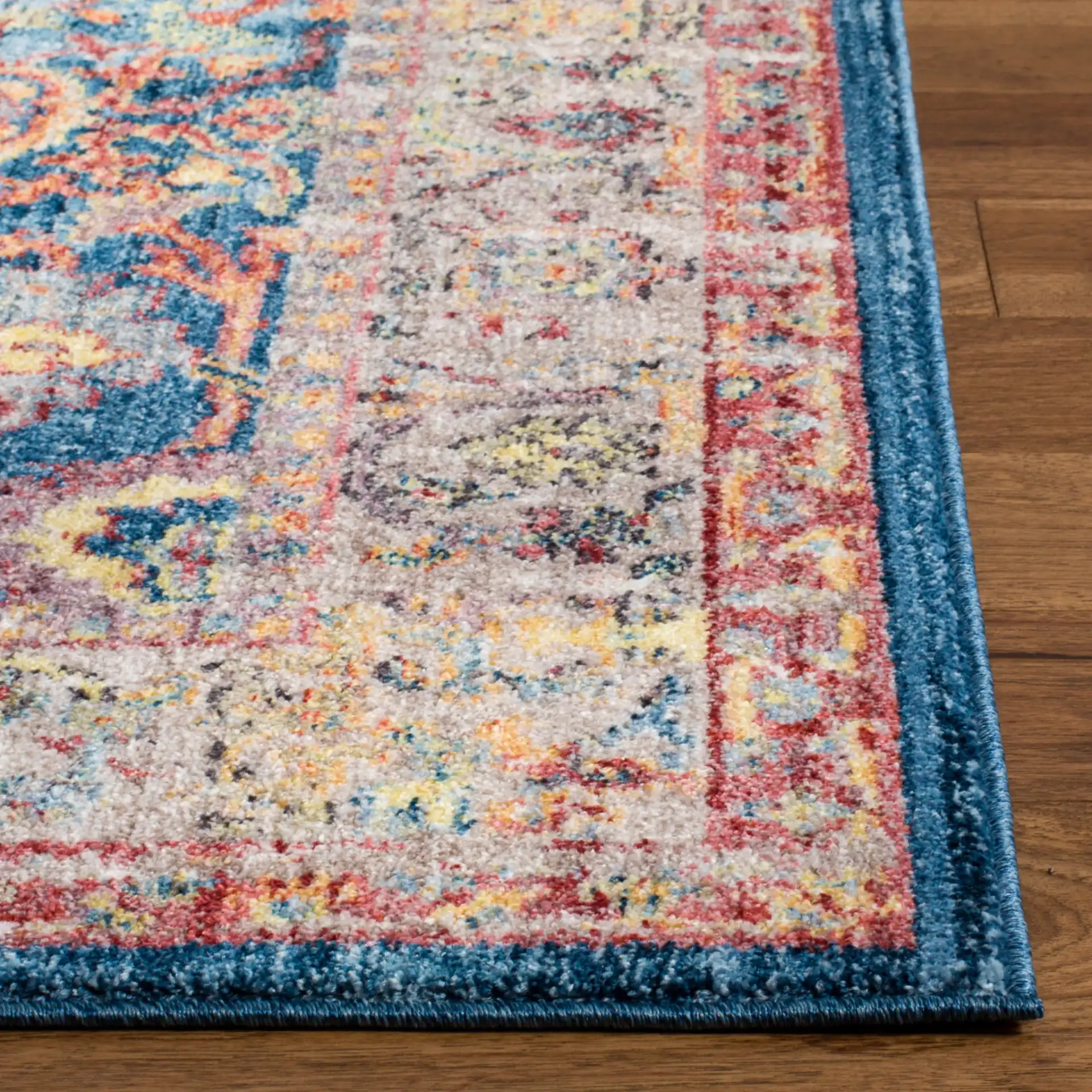 Bristol Persian Bordered Rug in Blue / Light Gray in a styled room