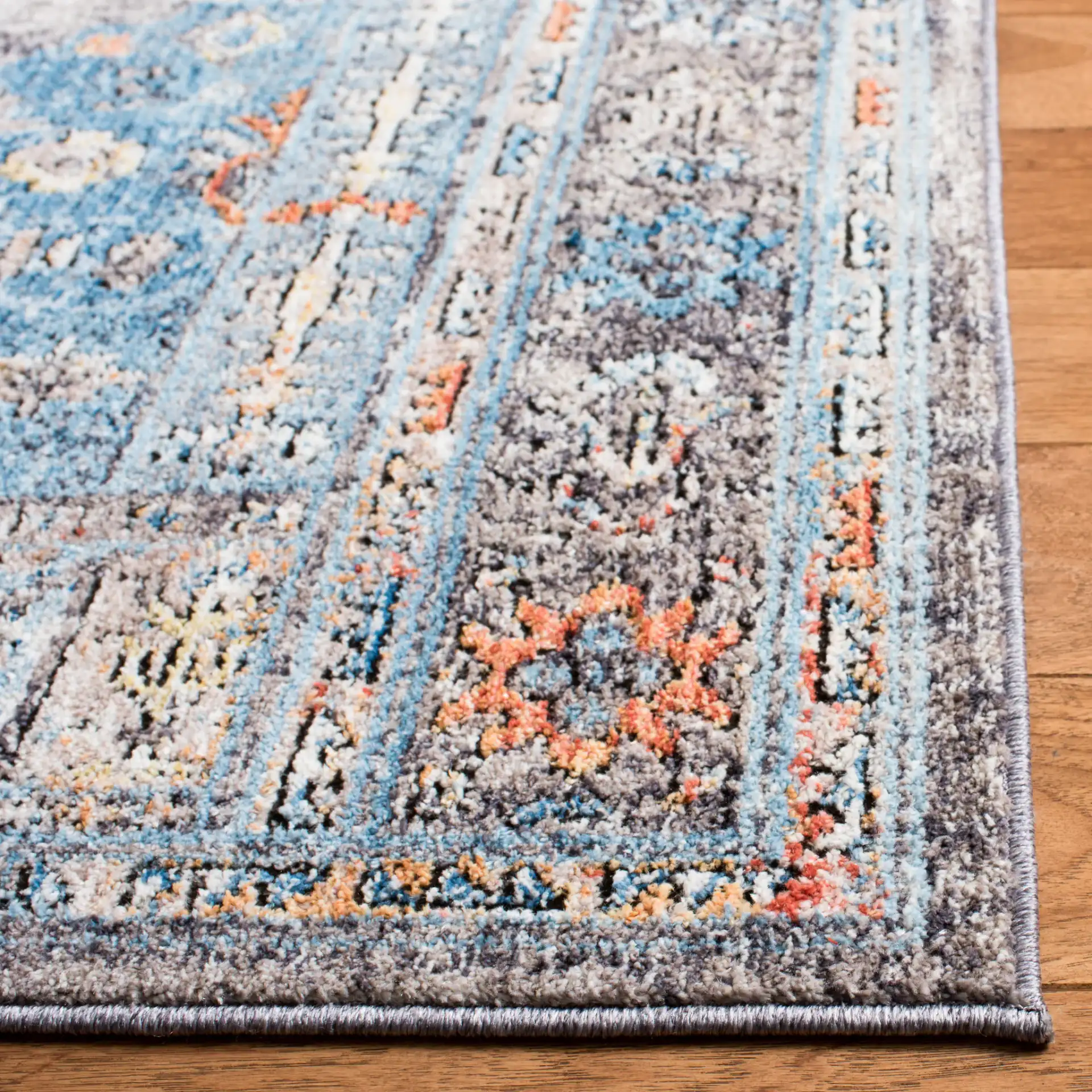 Bristol Stepped Medallion Rug in Gray / Blue in a styled room