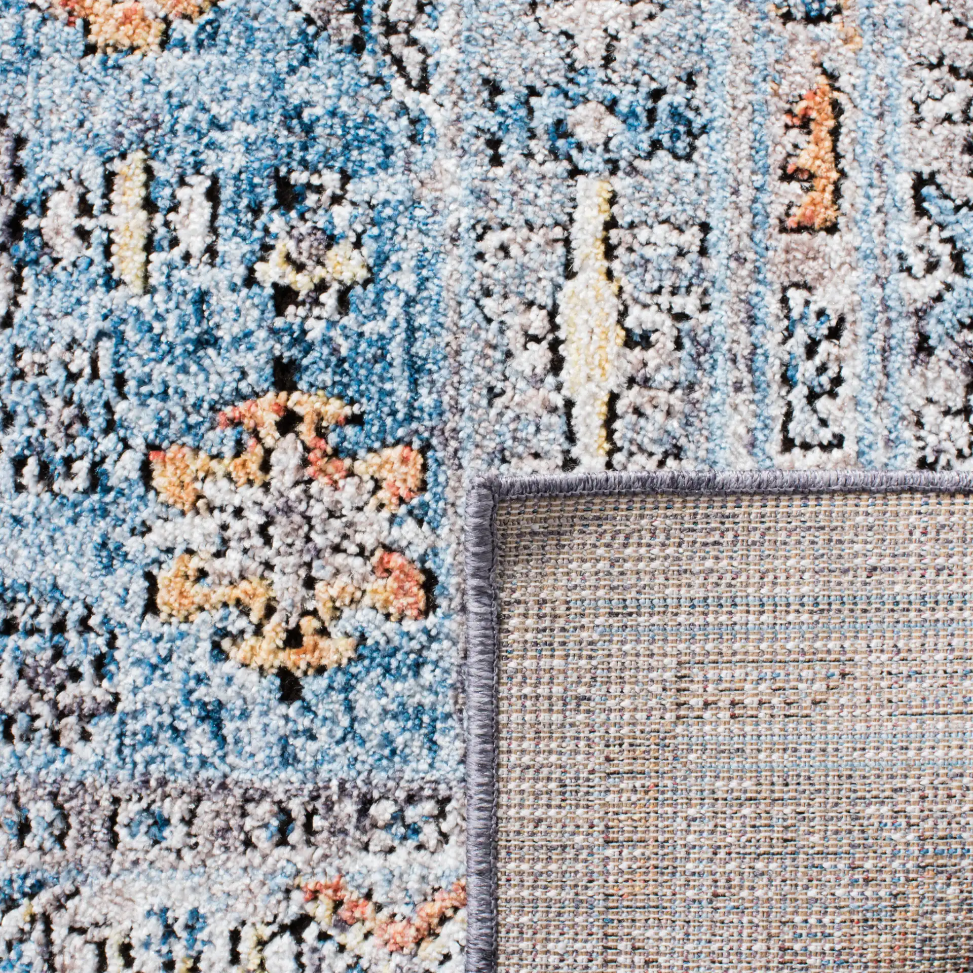 Bristol Stepped Medallion Rug in Gray / Blue in a styled room