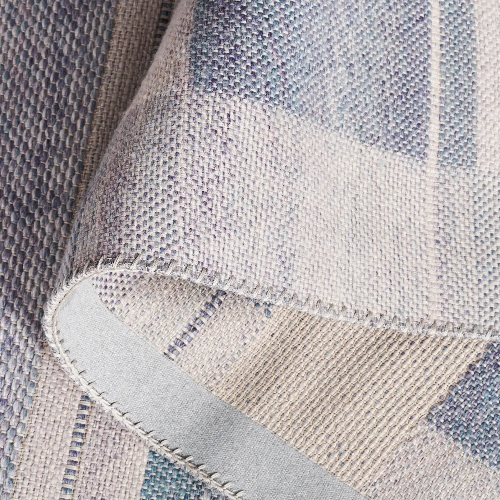 Cabo Striped Border Rug in Blue / Purple in a styled room