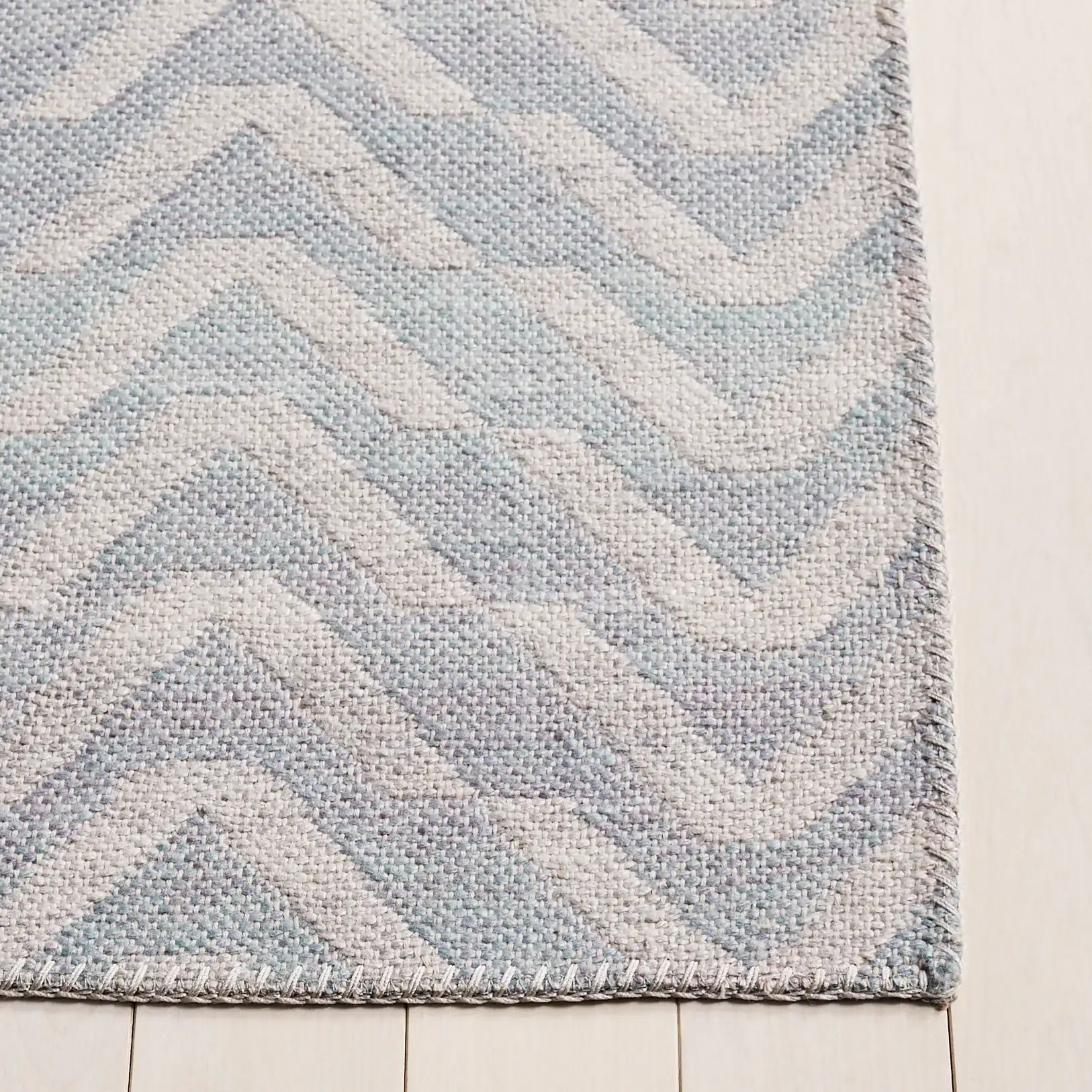 Cabo Chevron Rug in Light Blue / Beige in a styled room