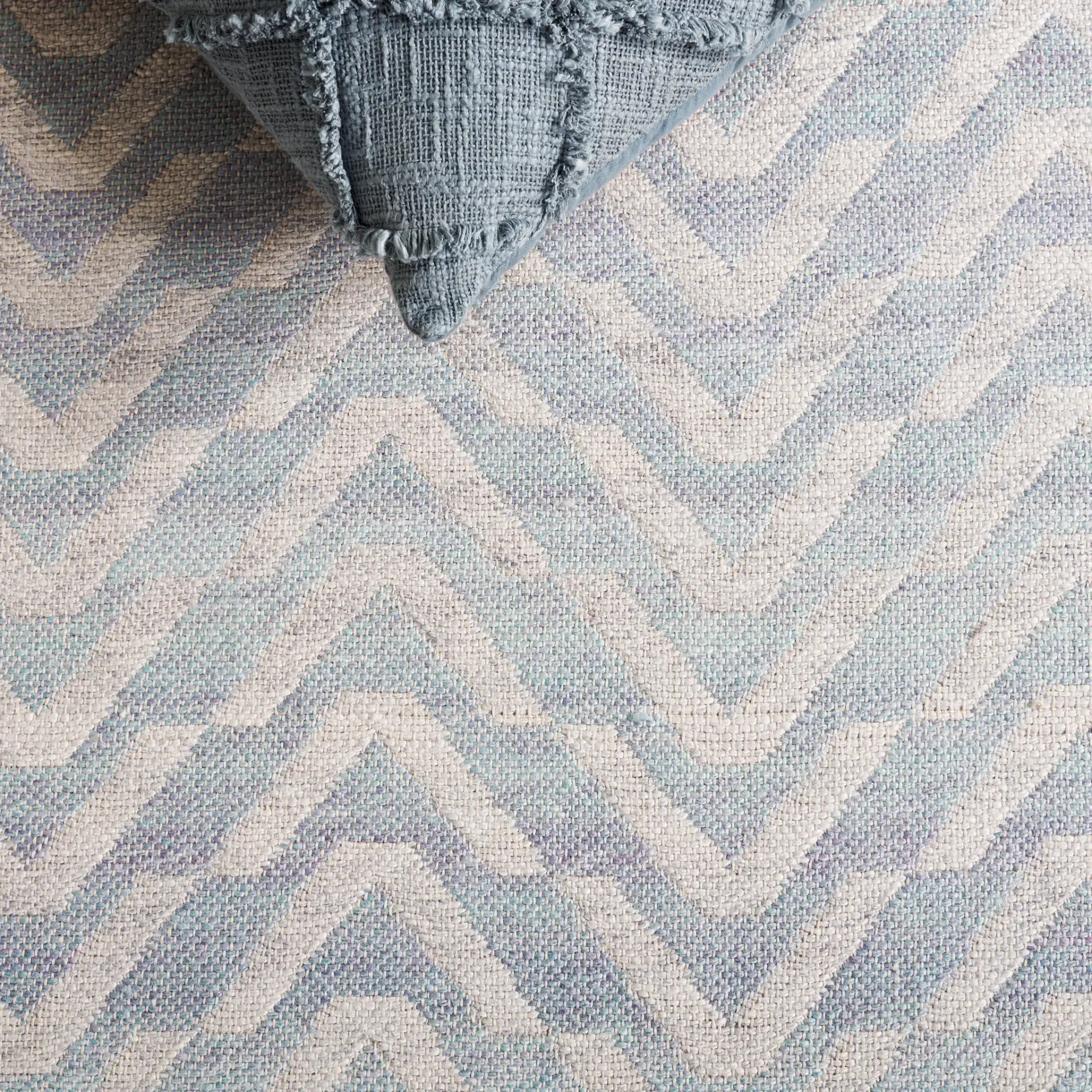 Cabo Chevron Rug in Light Blue / Beige in a styled room