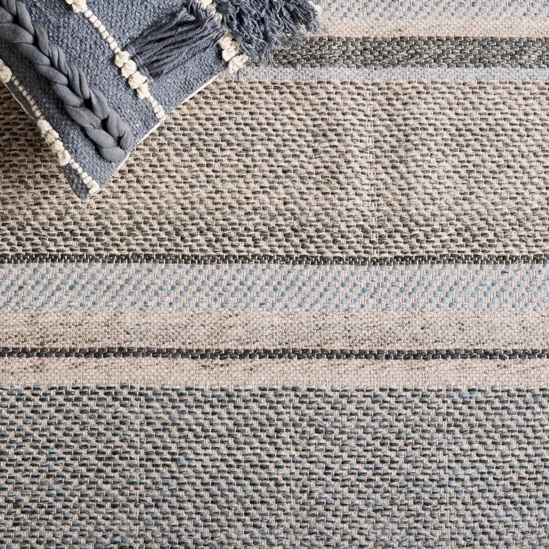 Cabo Striped Rug in Black / Light Blue in a styled room