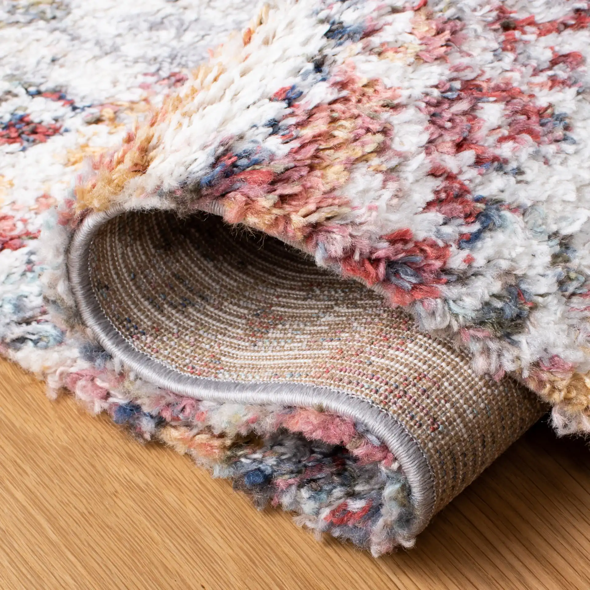 Calista Diamond Medallion Shag Rug in Ivory / Rust in a styled room