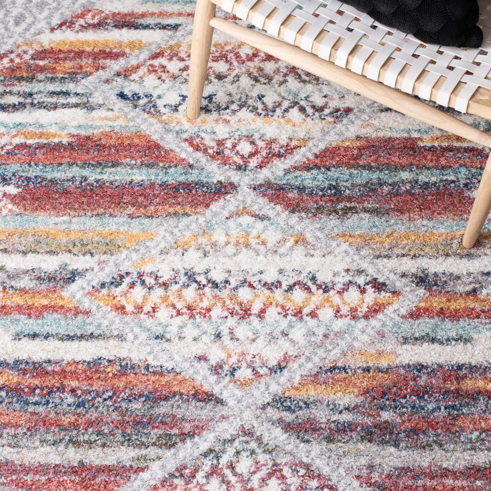 Calista Diamond Medallion Shag Rug in Ivory / Rust in a styled room