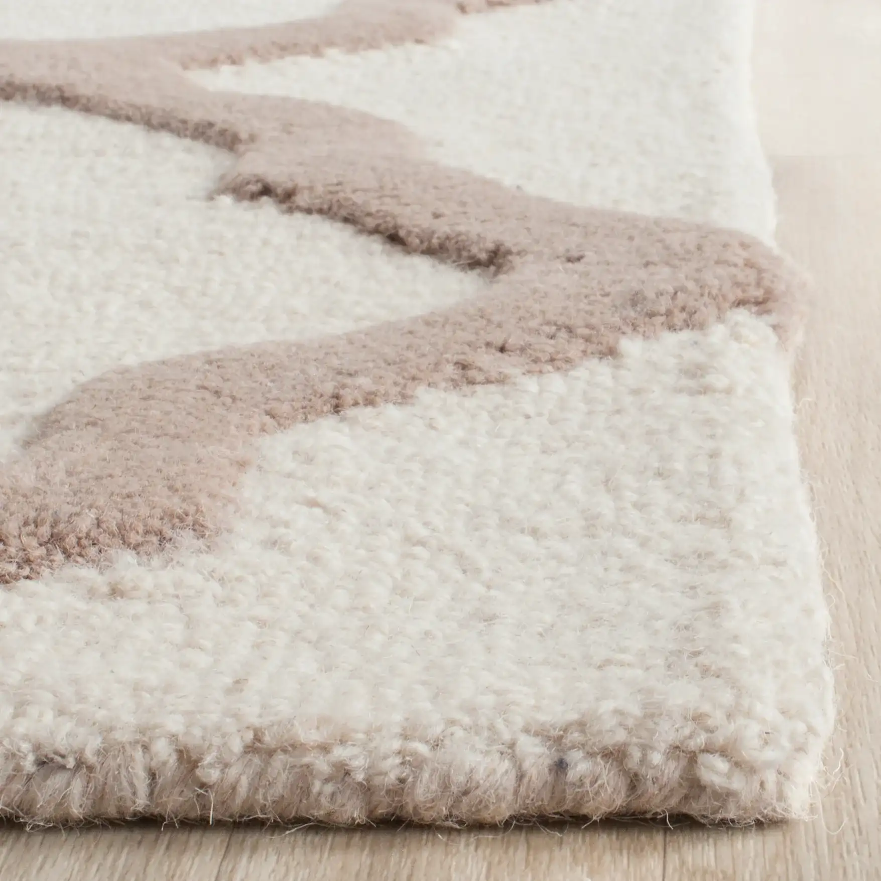 Cambridge Trellis Hand-Tufted Rug in Ivory / Beige in a styled room