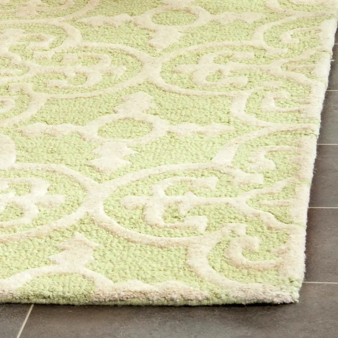 Cambridge Ornate Quatrefoil Hand-Tufted Wool Rug in Light Green / Ivory in a styled room