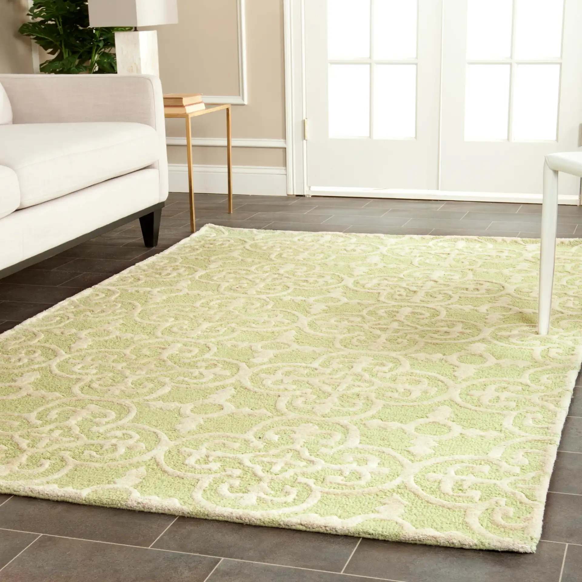 Cambridge Ornate Quatrefoil Hand-Tufted Wool Rug in Light Green / Ivory in a styled room