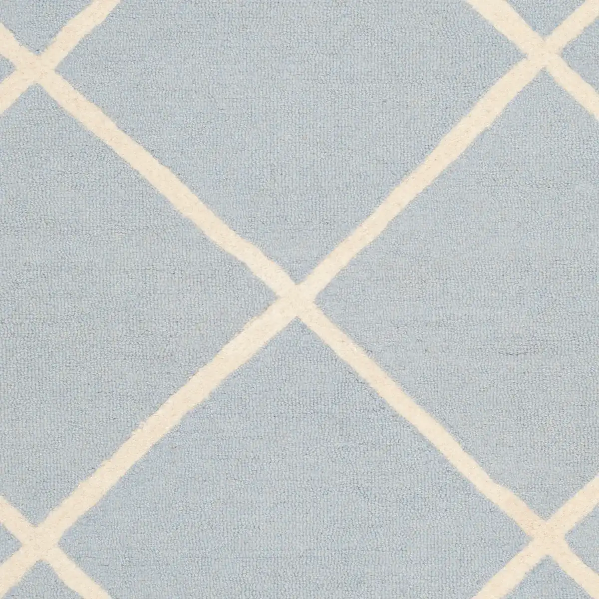 Cambridge Diamond Trellis Hand-Tufted Wool Rug in Light Blue / Ivory in a styled room