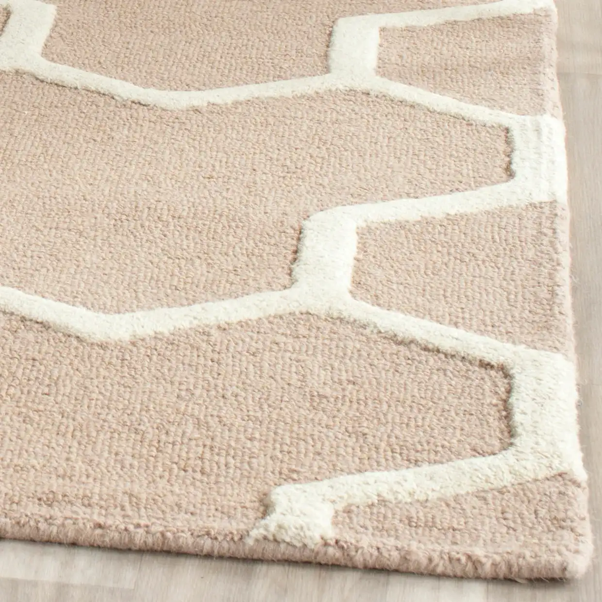 Cambridge Interlocking Geometric Hand-Tufted Wool Rug in Beige / Ivory in a styled room