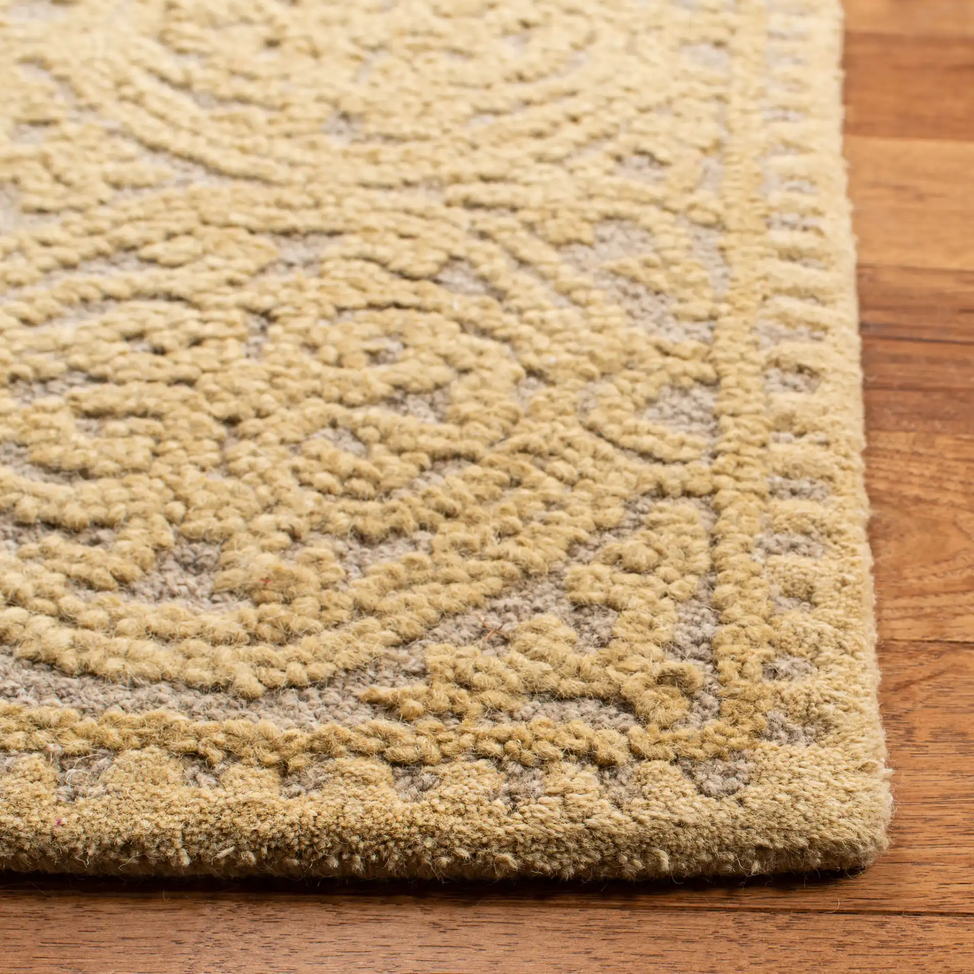 Cambridge Interlocking Circle Hand-Tufted Wool Rug in Light Gold / Dark Gold in a styled room