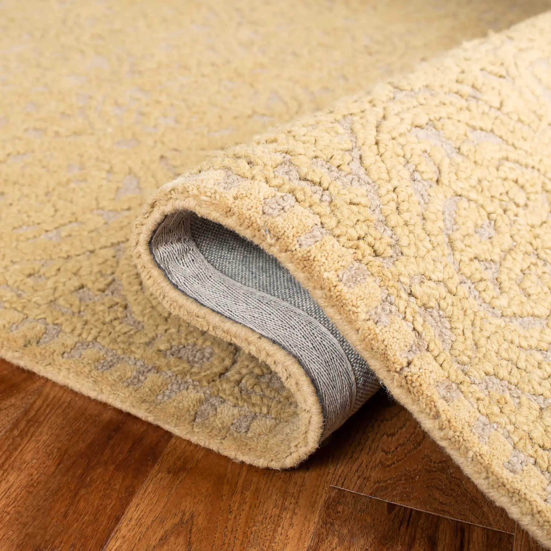 Cambridge Interlocking Circle Hand-Tufted Wool Rug in Light Gold / Dark Gold in a styled room