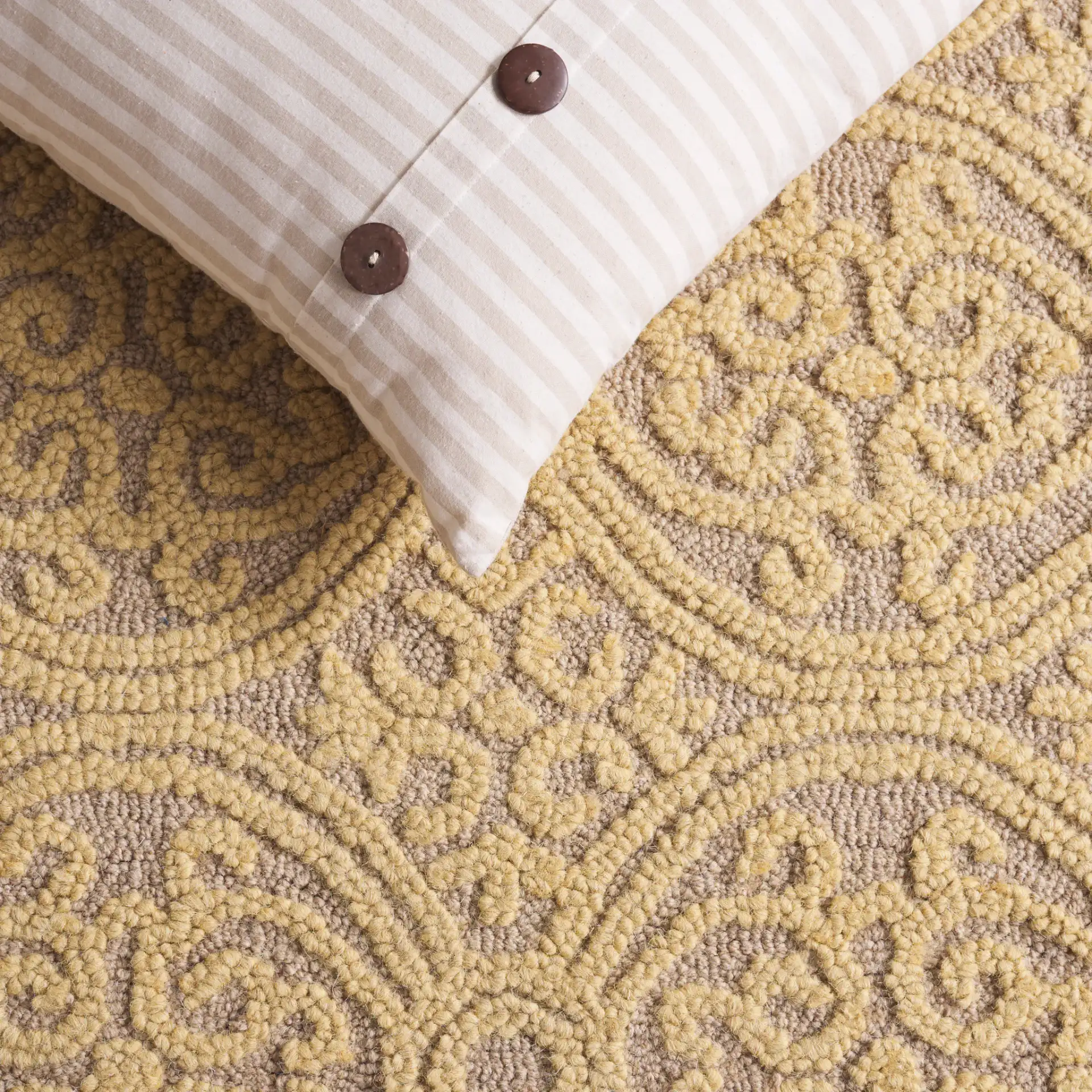 Cambridge Interlocking Circle Hand-Tufted Wool Rug in Light Gold / Dark Gold in a styled room