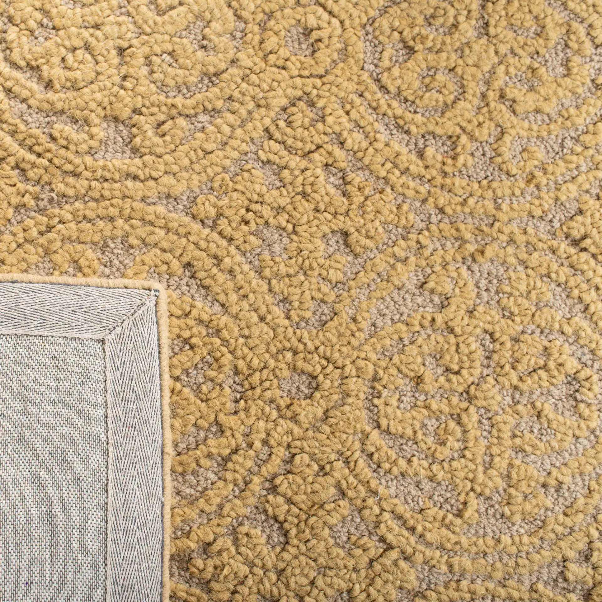 Cambridge Interlocking Circle Hand-Tufted Wool Rug in Light Gold / Dark Gold in a styled room